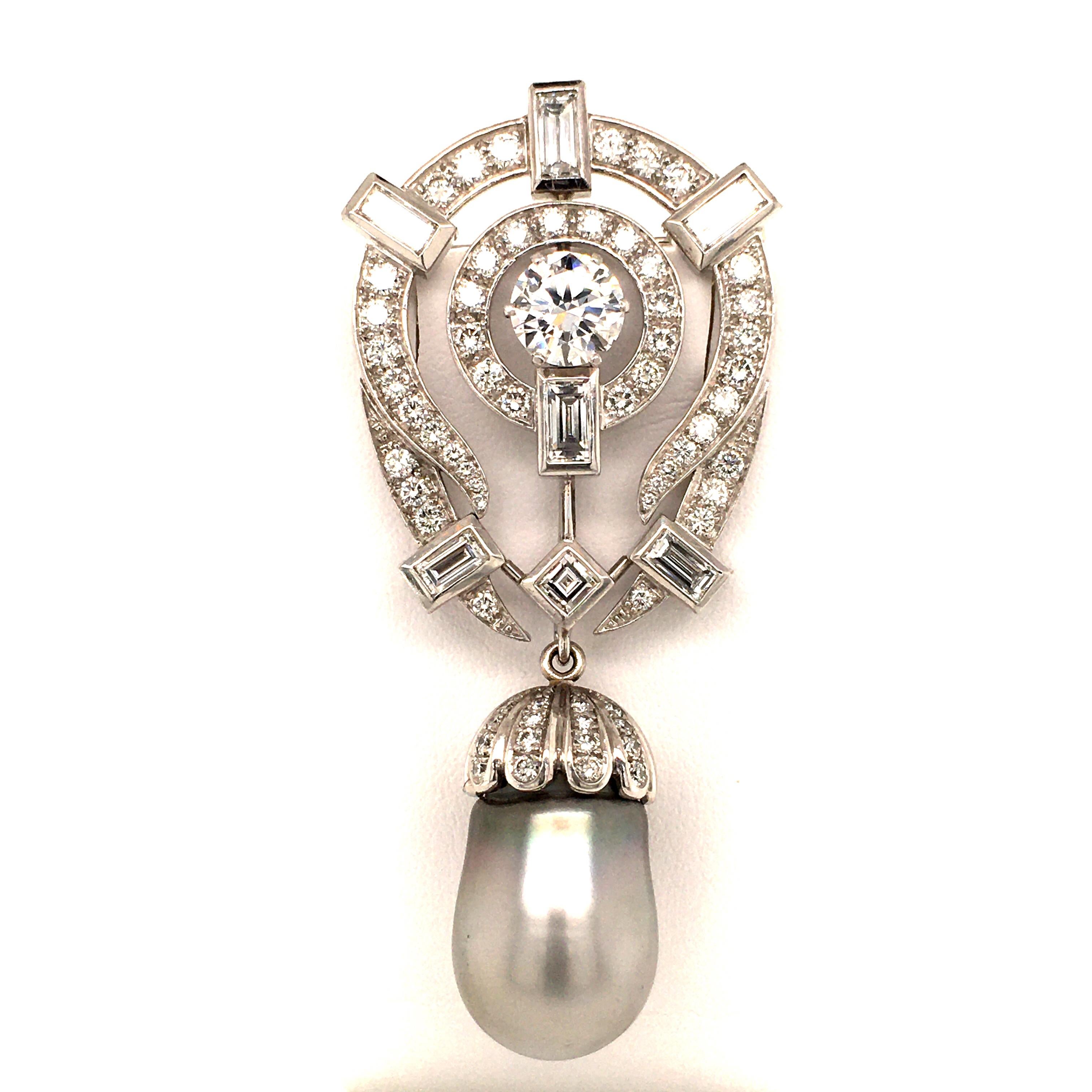 This flamboyant pendant brooch features a Tahitian cultured pearl drop of 21.5 by 14 mm. The main body of the brooch is set with a brilliant cut diamond of 1.60 carats, F/G color and vs1 clarity. Accented with 64 brilliant cut diamonds of G/H color