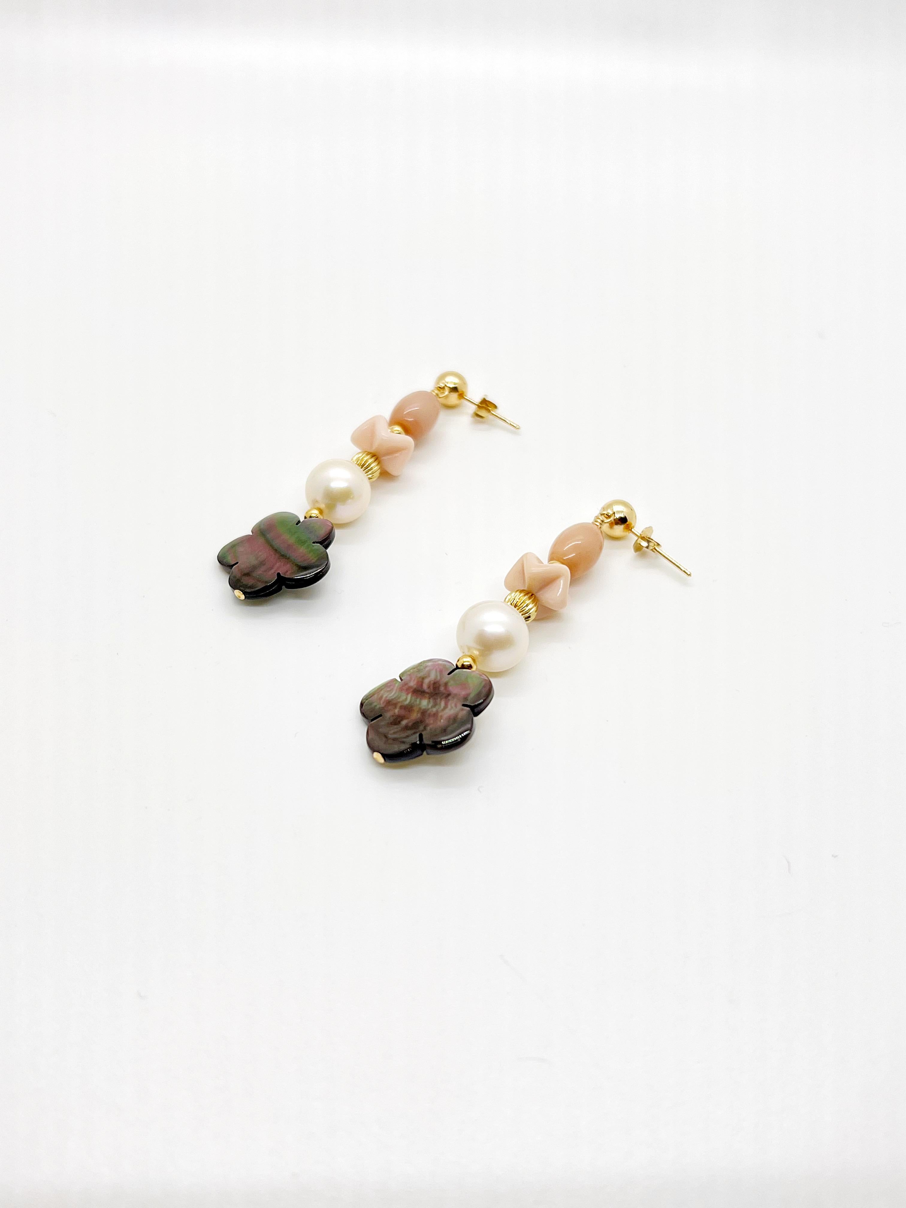 Artisan made flowers made from Tahitian shells that gives such beautiful iridescent shine, like a rainbow in the flower. Glass beads and pearls compliment and finished with gold filled earring stud.