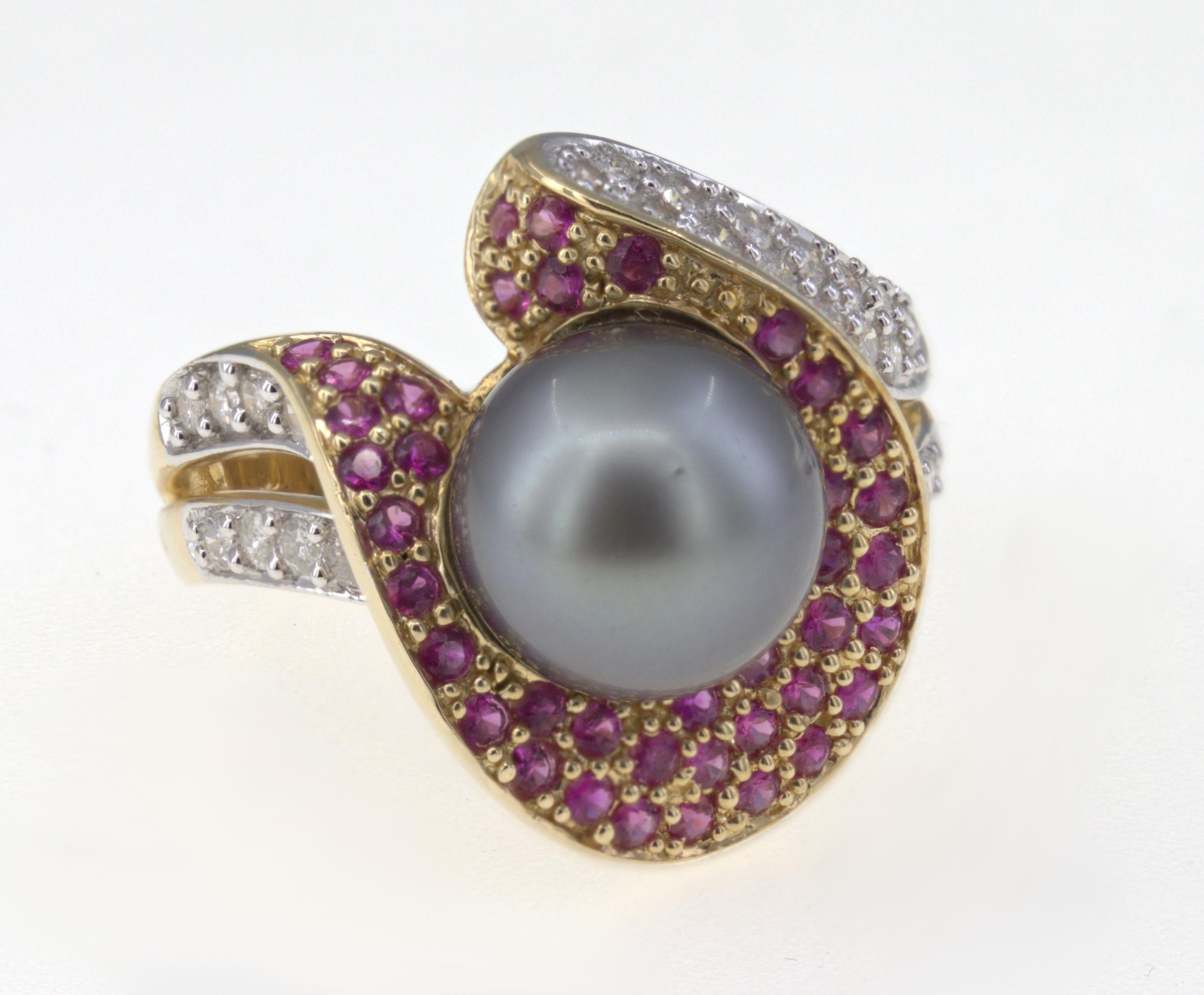 Featuring (1) gray Tahitian 9.8 mm, cultured pearl, surrounded by (42) round-cut rubies, 0.75 carat total weight, accented by (31) full-cut diamonds, 0.50  carat total weight I, H-I, pave set in a 14k yellow gold asymmetric sculpted mounting,
