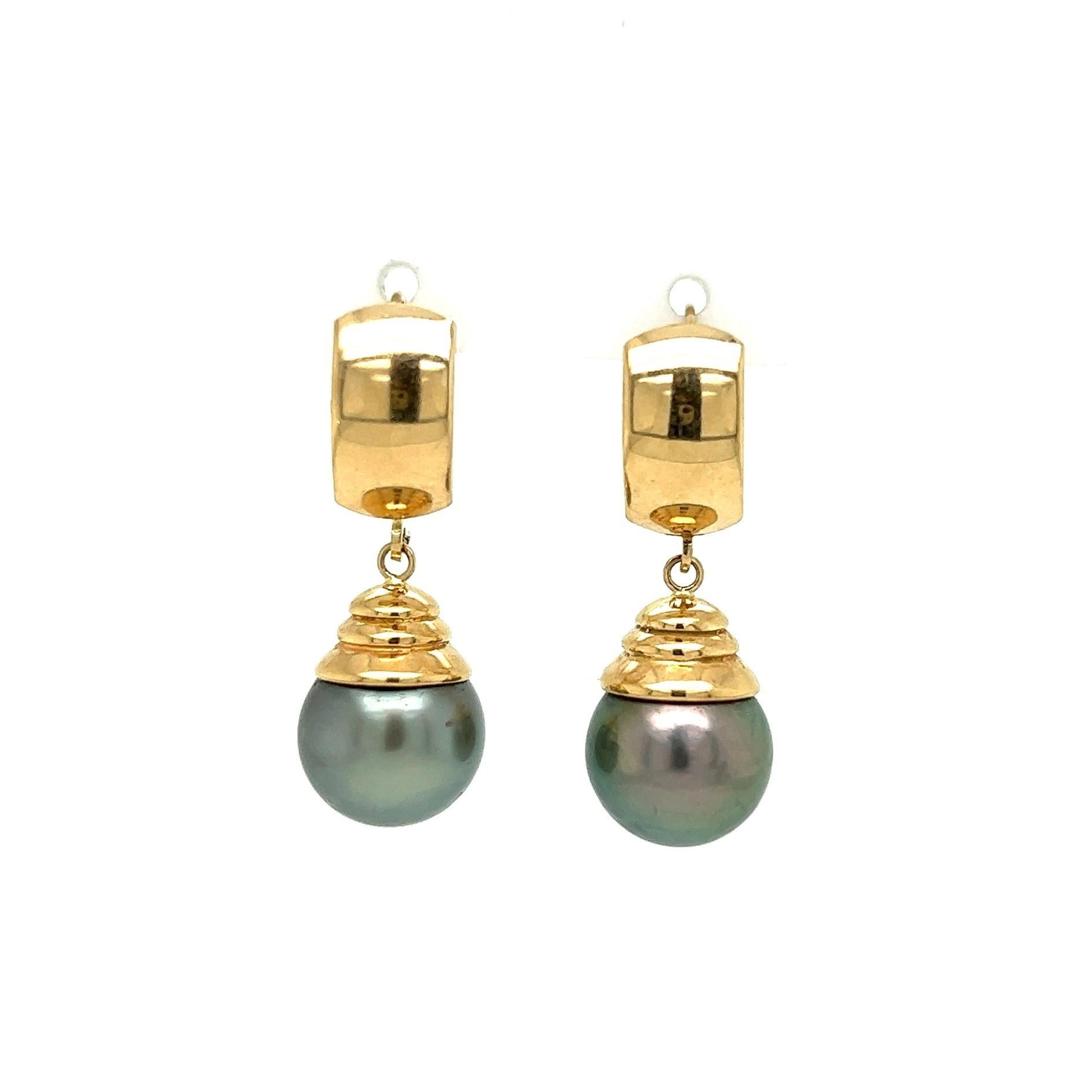 Simply Beautiful! Finely detailed Gold Drop Earrings. Each earring Hand set with a 11.3mm Tahitian Gray South Sea Pearl. Hand crafted 14K Yellow Gold mounting. Approx.  Dimensions: 1.25” l x 0.44” w. More Beautiful in real time! A piece you’ll turn