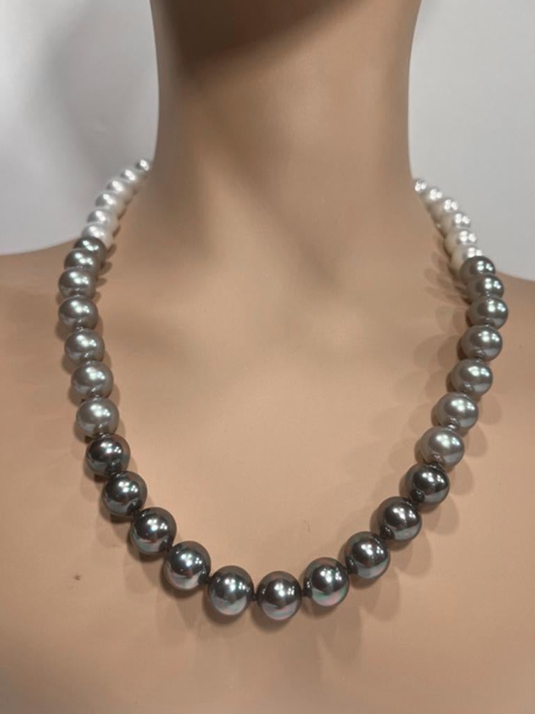 
Mint, unworn, and perfect Tahitian handmade South Sea costume jewelry Japanese high-lustre 10mm pearl multicolour necklace, hand-strung silk knotted,  made for Bergdorf Goodman and attached to CZ sterling screw-ball clasp. 26 inches long