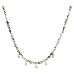 Tahitian keshi pearl strand with 0.59 carat diamond charms Hi June Parker