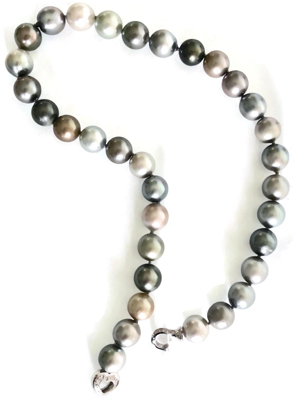 This stunning Tahitian Pearl Necklace With An 18k White Gold and Diamond Heart-Shaped Clasp is a basic classic Tahitian Pearl necklace with a twist.  The combination of the 