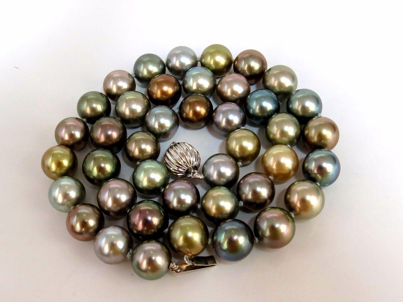 10.1-10.8MM Natural Tahitian Multi color pearls necklace.

Prime Luster & Excellent Saturation

41 pearls

Strung with ball clasp.

14Kt white gold.

18 inches

Grand Total 64 grams

Appraisal will accompany for: $12,000