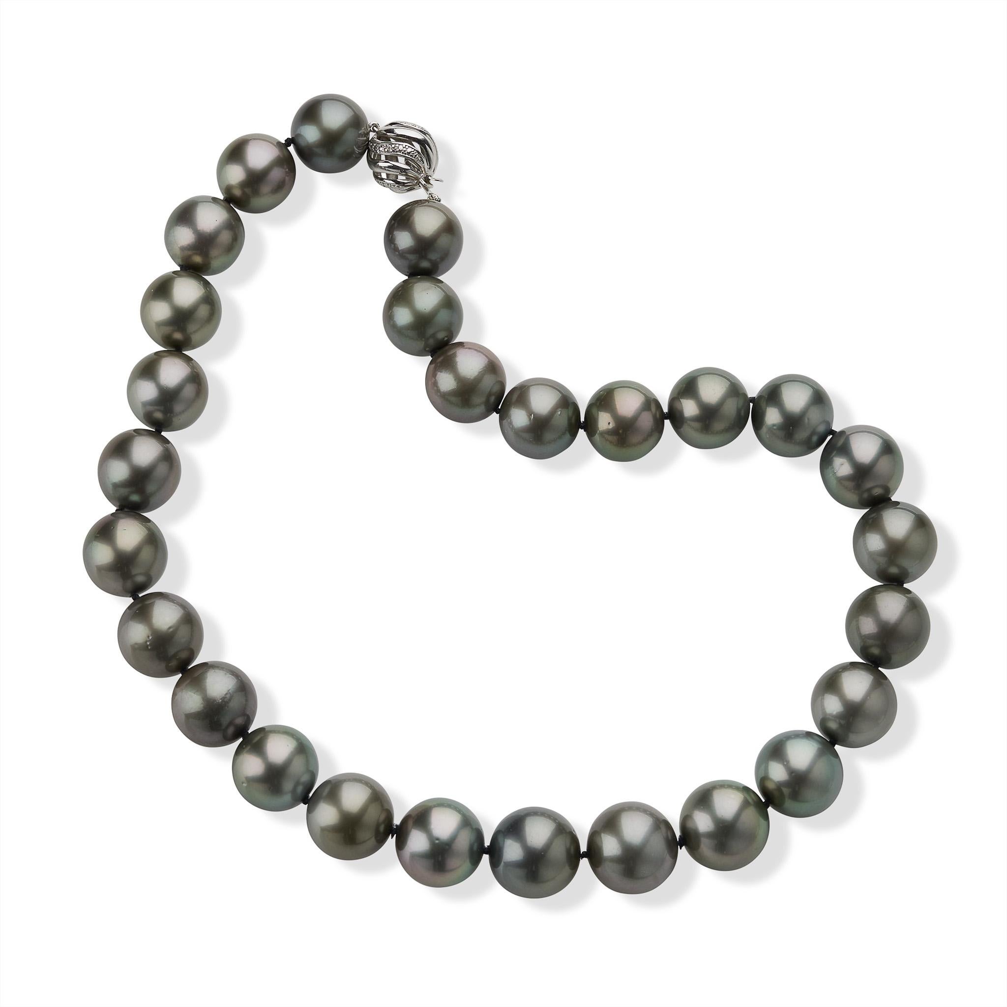 This contemporary necklace is composed of 27 cultured round Tahitian pearls, measuring approximately 16.70 x 15.00mm. The necklace of natural color silvery, gun metal pearls with subtle rose tones is completed by a 14K white gold swirl-motif boule