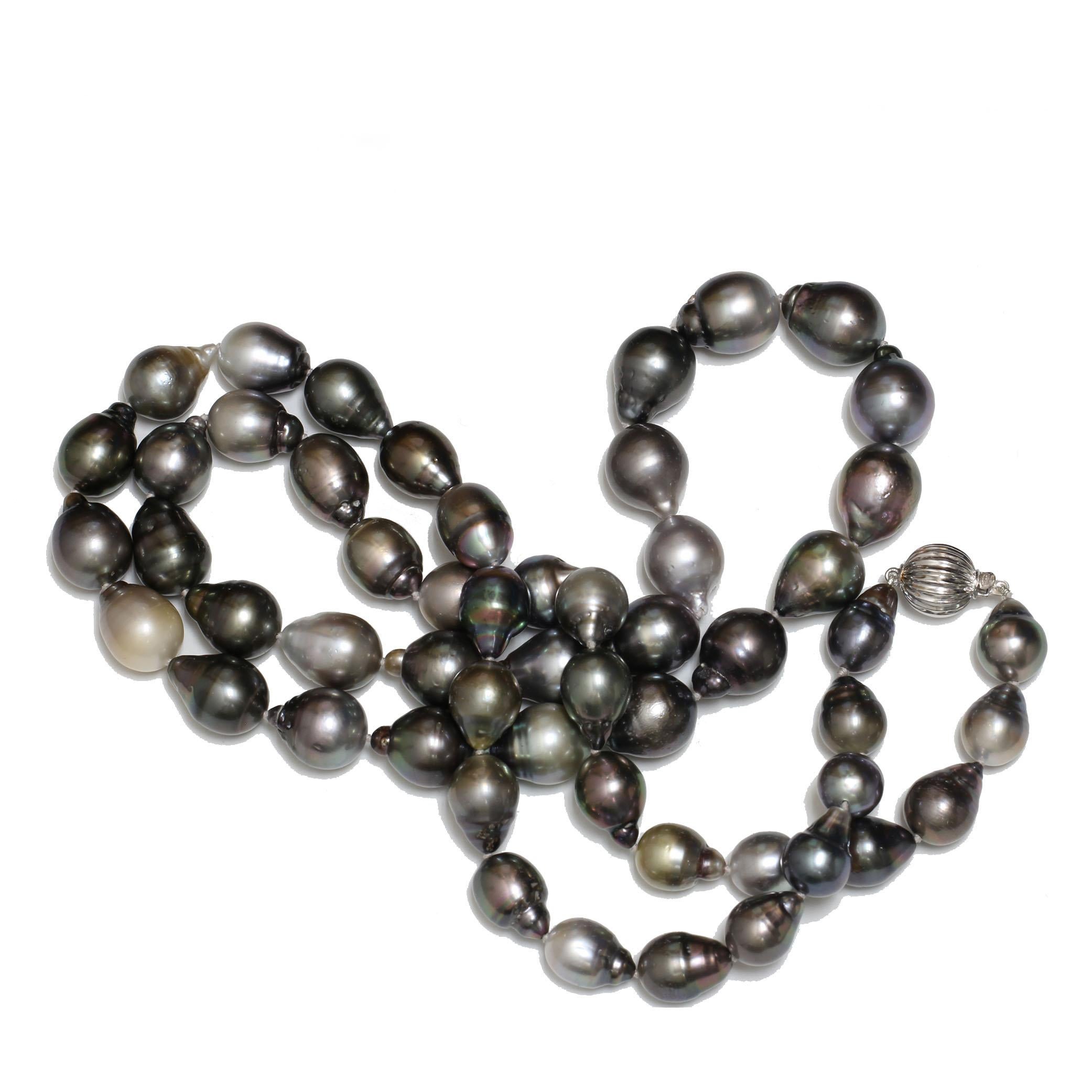 

Tahitian opera length pearl necklace AAA- in surface clarity with 13 to 10 mm in size. The pearls are natural colors of black with of silver, beige, gray with blue, peacock and green overtones. The length is 34