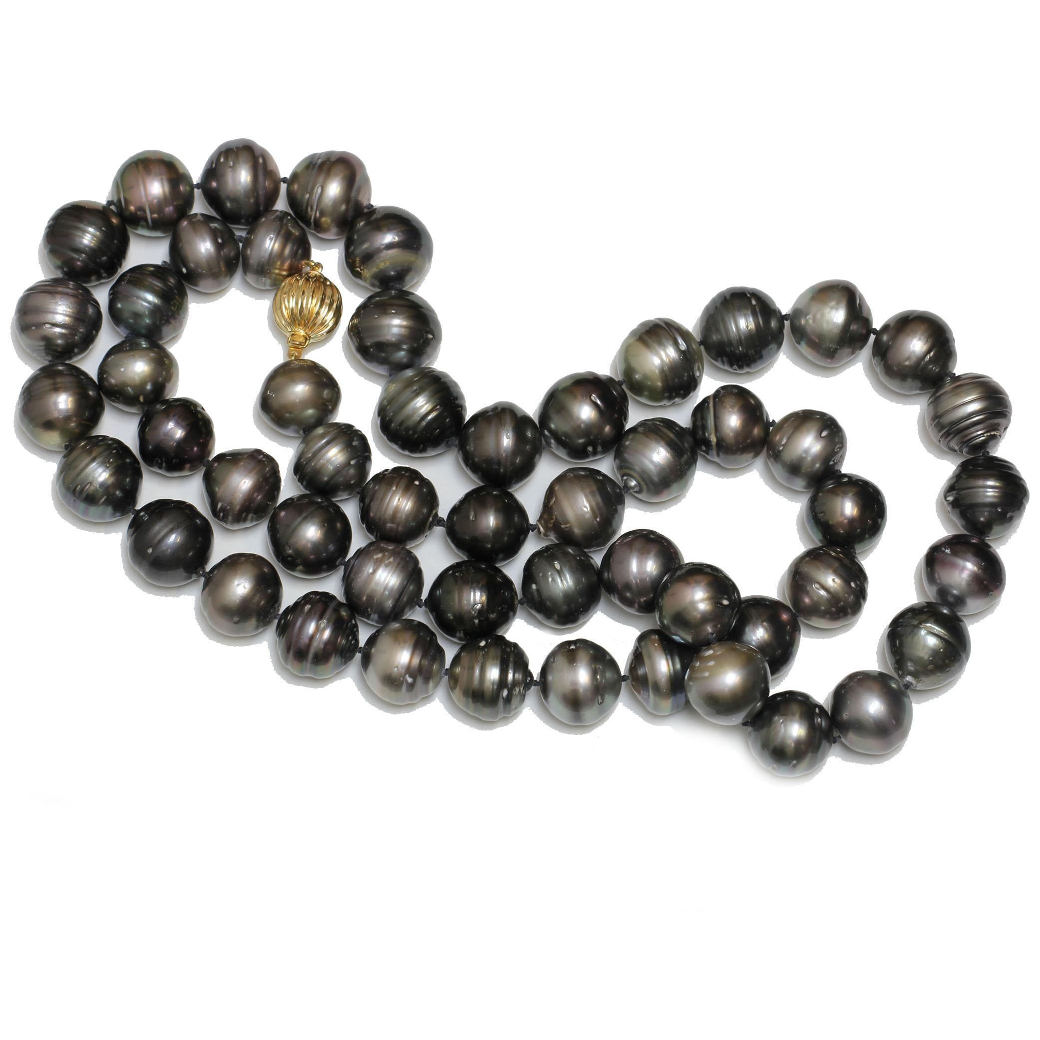 Origin:	French Polynesia
Pearl Type:	Tahitian Pearls
Pearl Size:	17.3 - 15.0 MM
Pearl Color:	Natural Multicolor Black, Green, and Shades of Grays
Pearl Shape:	Near Round / Short Oval
Pearl Surface: AAA-
Pearl Luster:	AAA Gem
Pearl