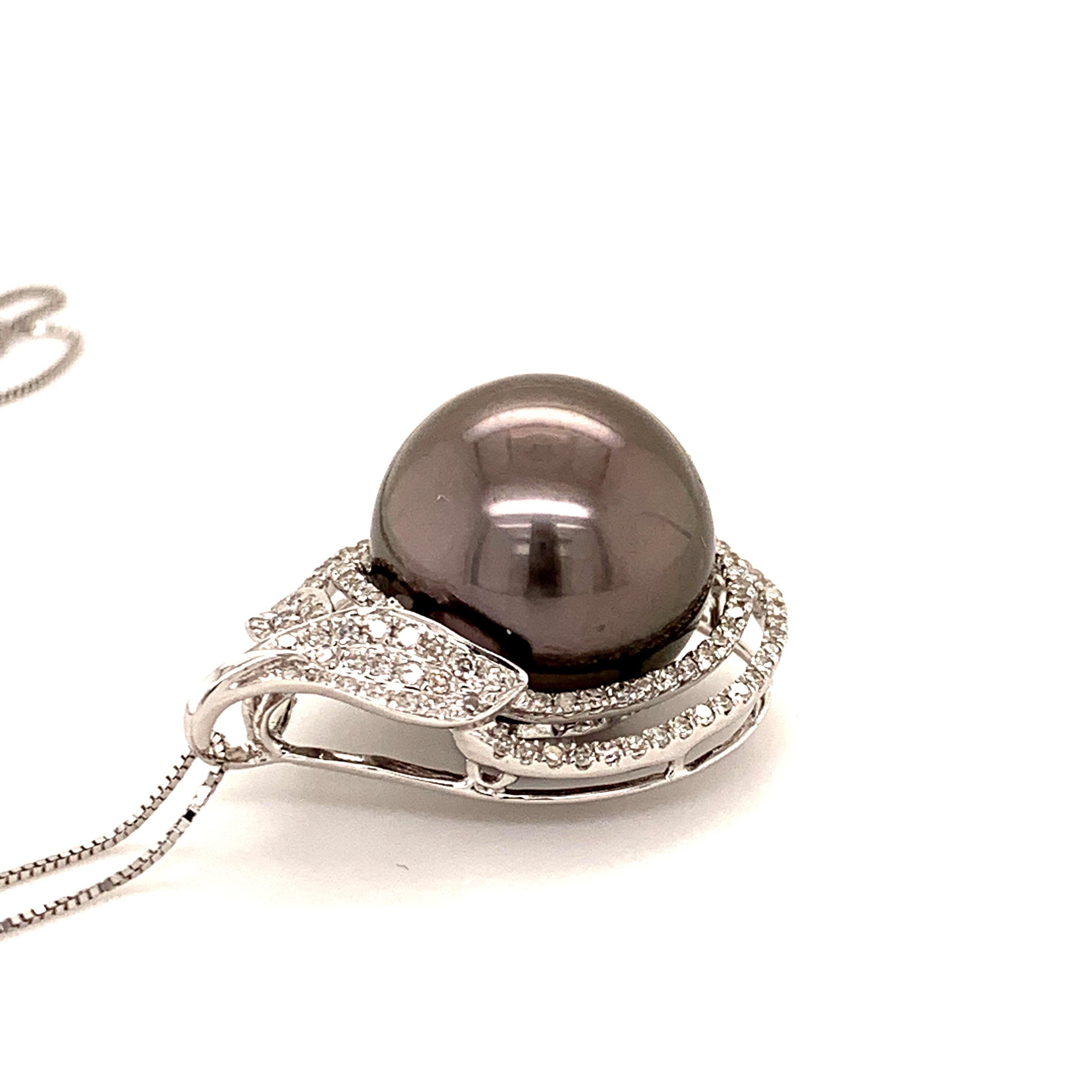 Elegant Tahitian pearl diamond pendant. Very good lustre, black with pink, silver overtone, 14.7mm round Tahitian pearl, surrounded with two rows of round brilliant cut diamonds. Handcrafted design set in high polished 18 karats white gold, along
