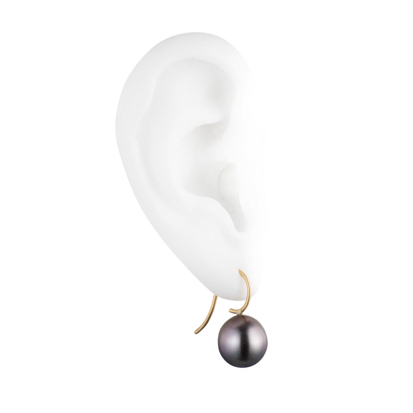 Simply elegant Tahitian cultured pearls suspended from 18K gold ear wires. Handmade in NYC.

Description:
These pearls are round to very slightly oval in shape and measure approximately 12.00 mm.

One photo features multiple earrings. This listing