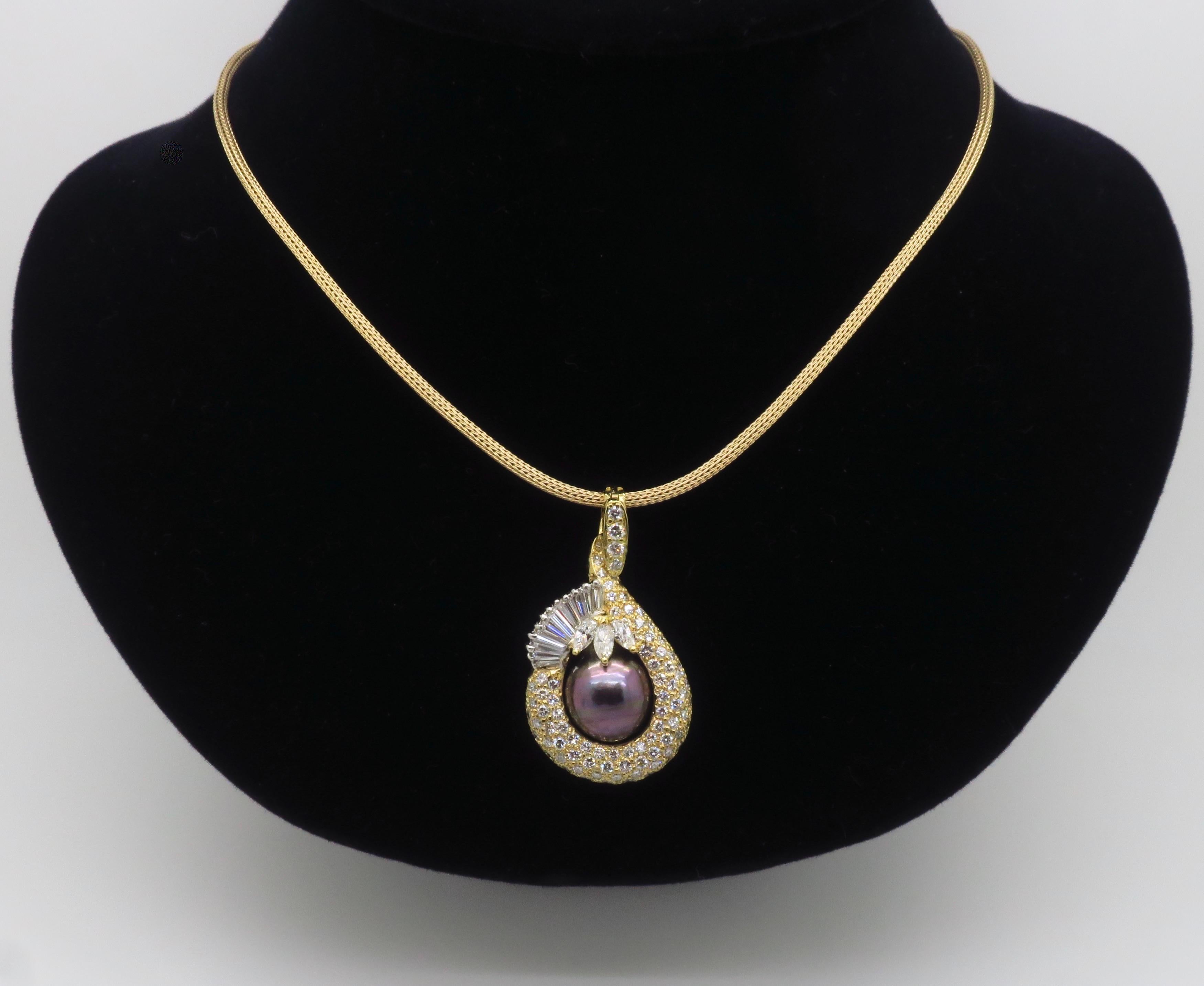 Incredible Tahitian pearl and 4.22CTW diamond pendant crafted in 18K yellow gold on a 14k yellow gold mesh chain. 

Gemstone: Tahitian Pearl & Diamond
Pearl Size: Approximately 12.1mm
Diamond Carat Weight: 4.22CTW
Diamond Cut: Round Brilliant Cut