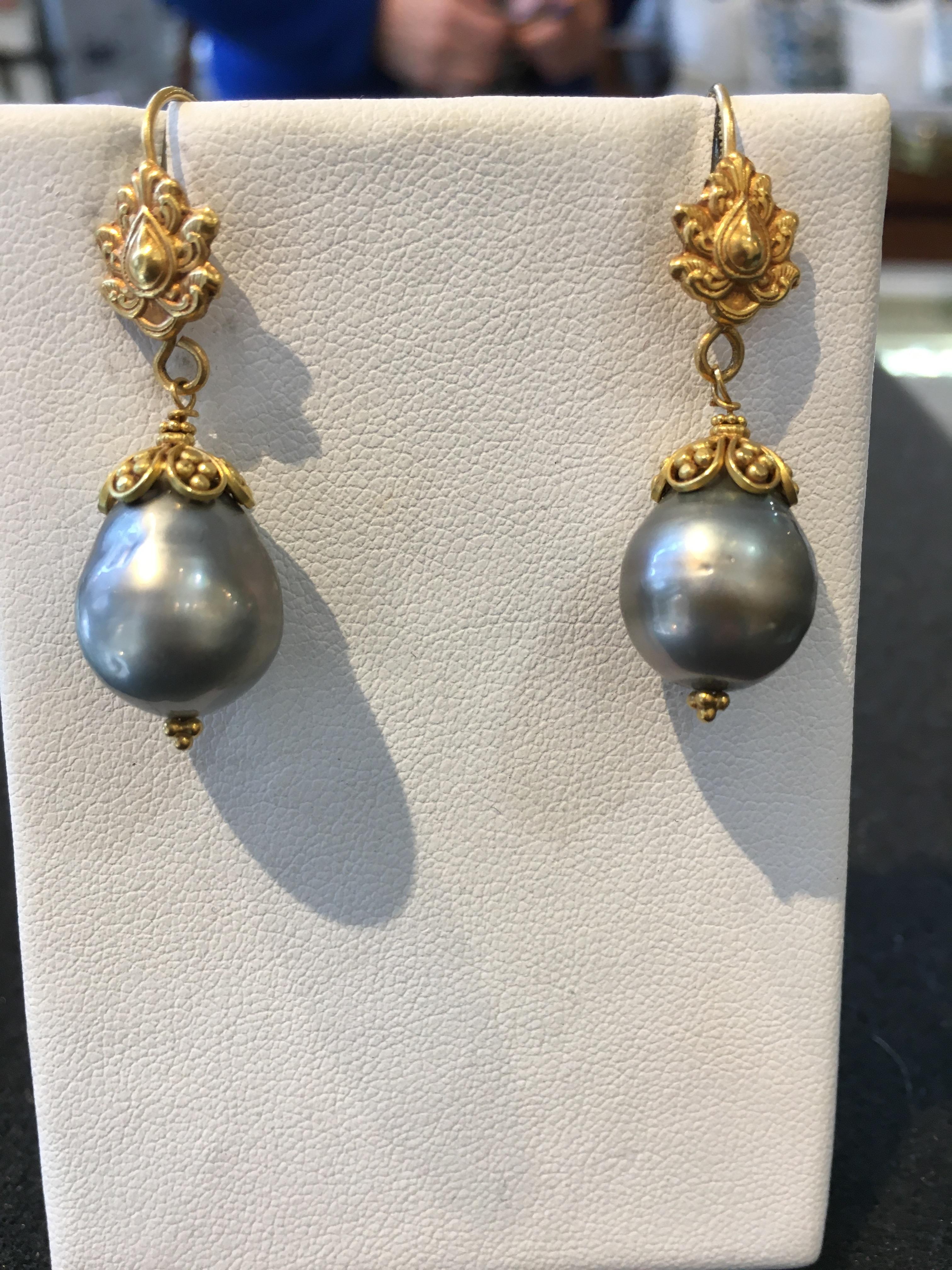 Pair of 22K gold and pear-shaped Tahitian pearl drop earrings.  On a French wire for pierced ears.  Pearls measure 12mm.  Fine hand tooling and granulation work to the high karat gold.  By Deborah Lockhart Phillips