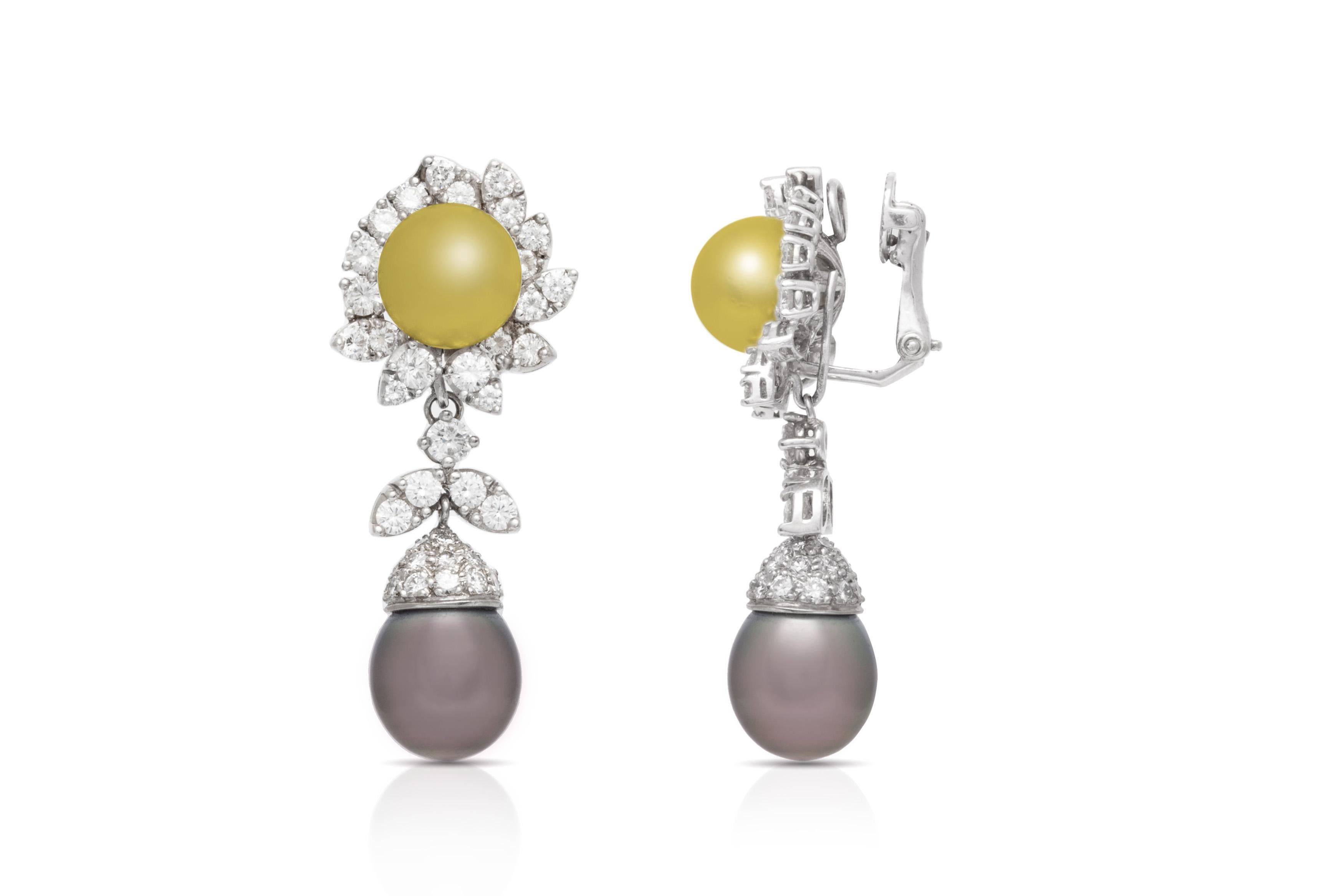 Finely crafted in 18k white gold with golden and grey Tahitian pearls, and Round Brilliant cut Diamonds weighing a total of approximately 5.84 carats.
1 3/4 x 5/8