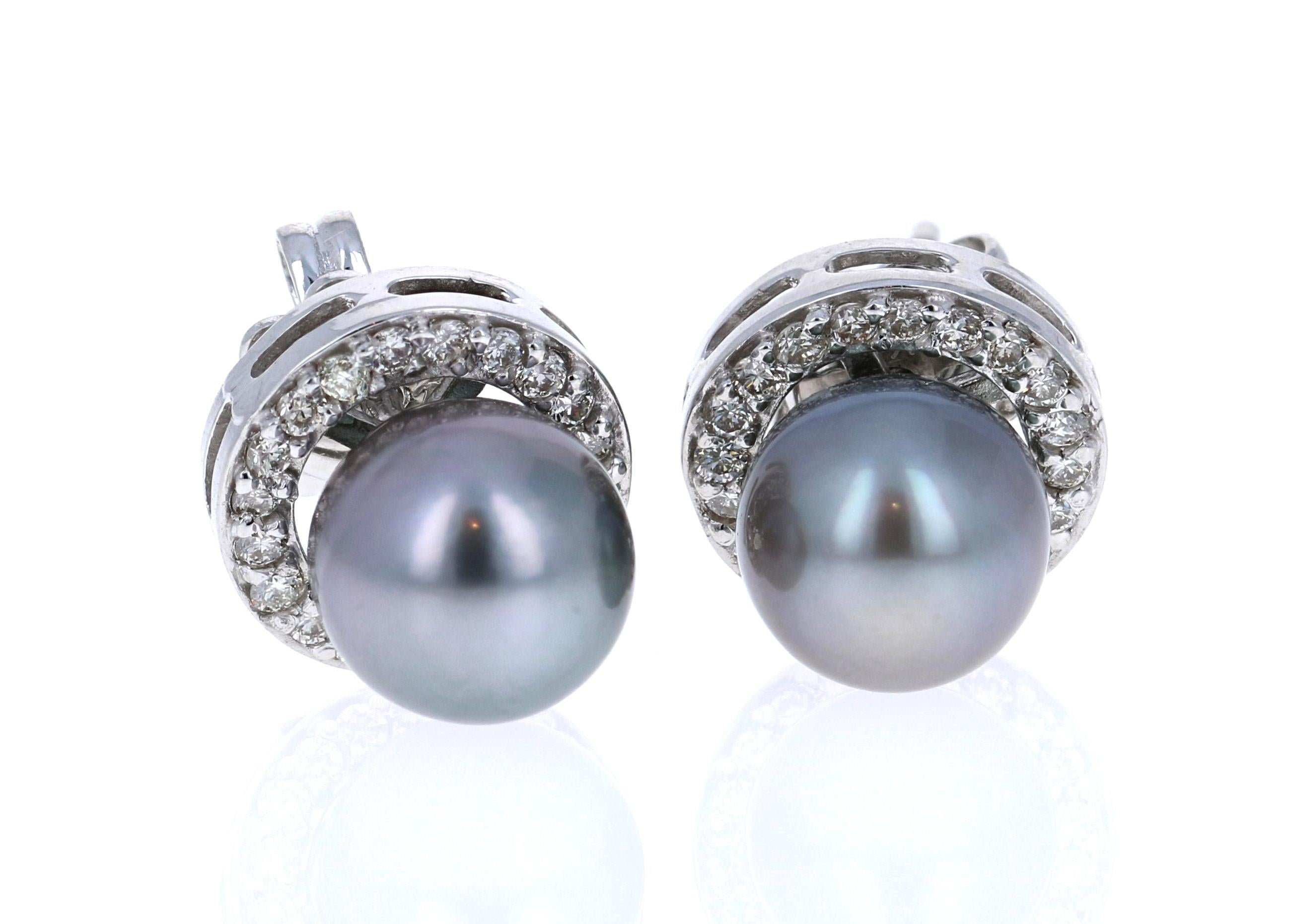 Tahitian Pearl Earrings that have 8 mm pearls and are surrounded by 40 Round Cut Diamonds that weigh 0.44 carats. 
The earrings are set in 14K White Gold and weigh approximately 2.8 grams. 

