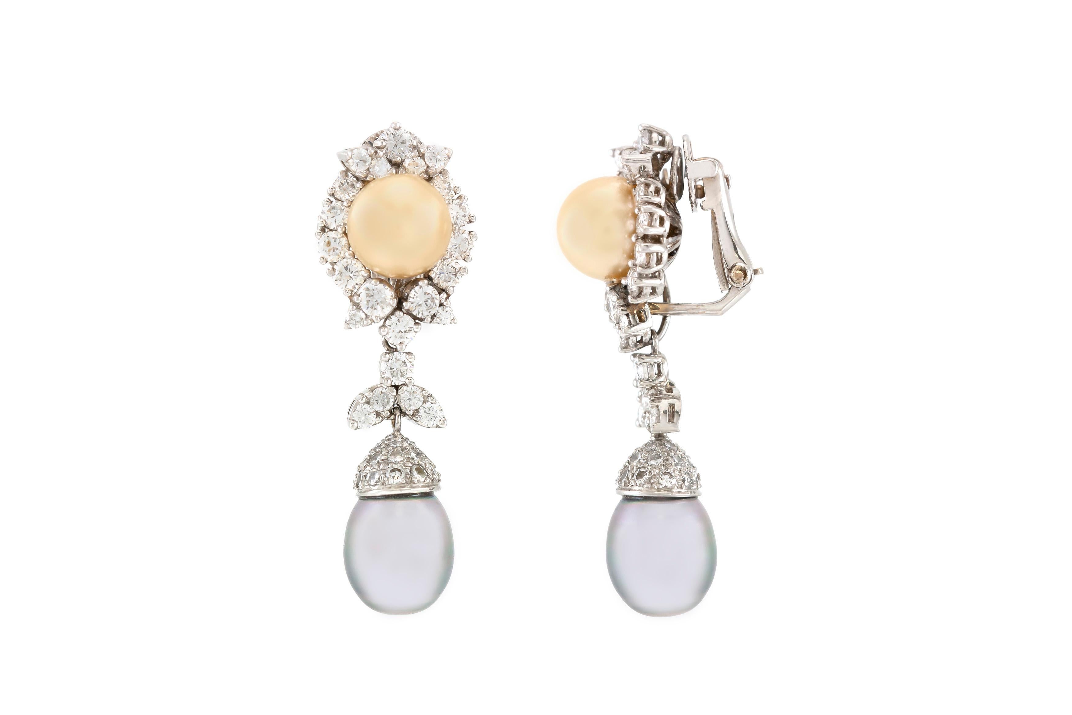 Beautiful golden and grey Tahitian pearl drop earrings are finely crafted in platinum. The diamonds weigh a total of approximately 5.36 carat.