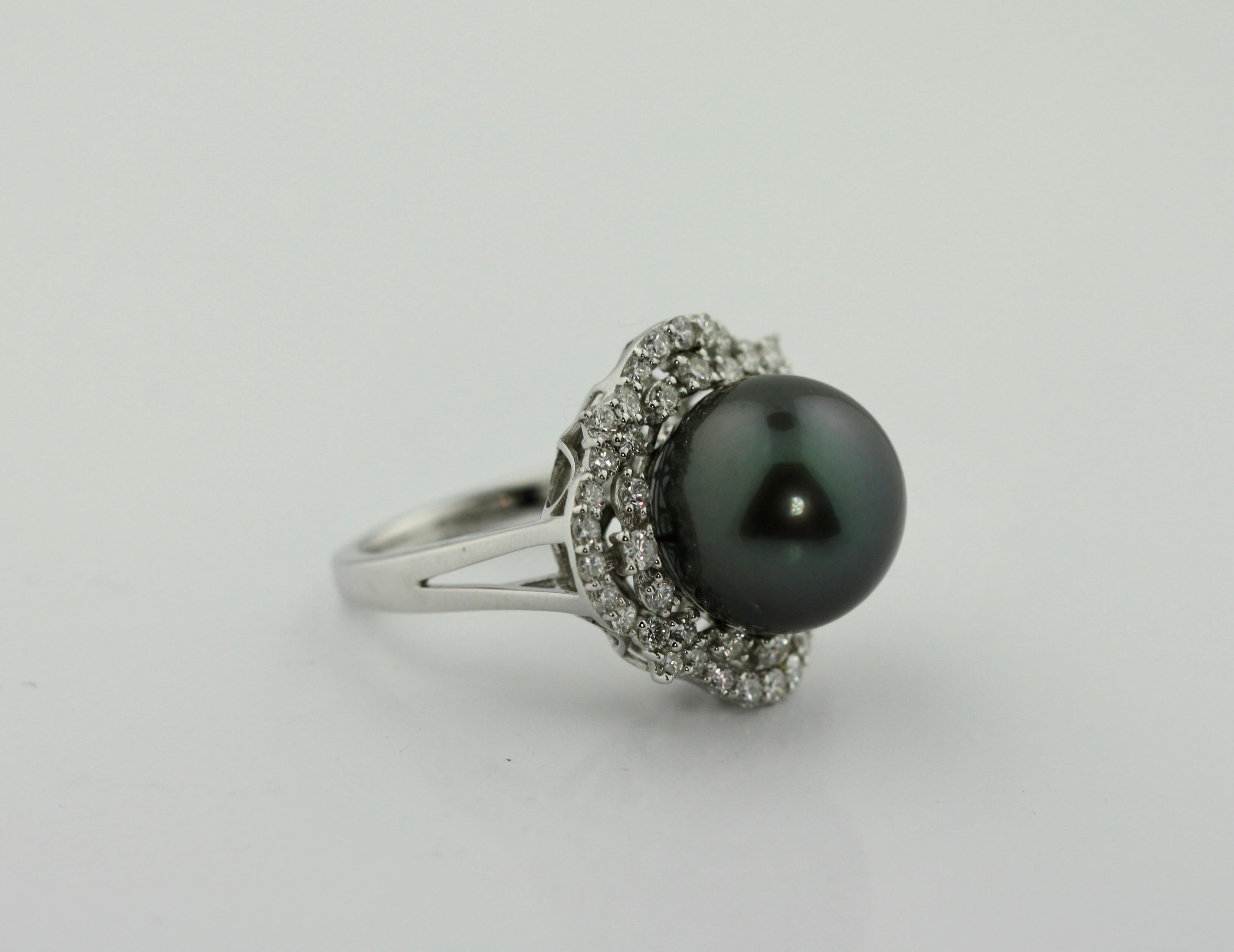 
Tahitian Pearl and Diamond Ring 
13mm Tahitian Pearl, Diamonds weighing approx. 1.07 carats
size 7
accompanied A I G appraisal 