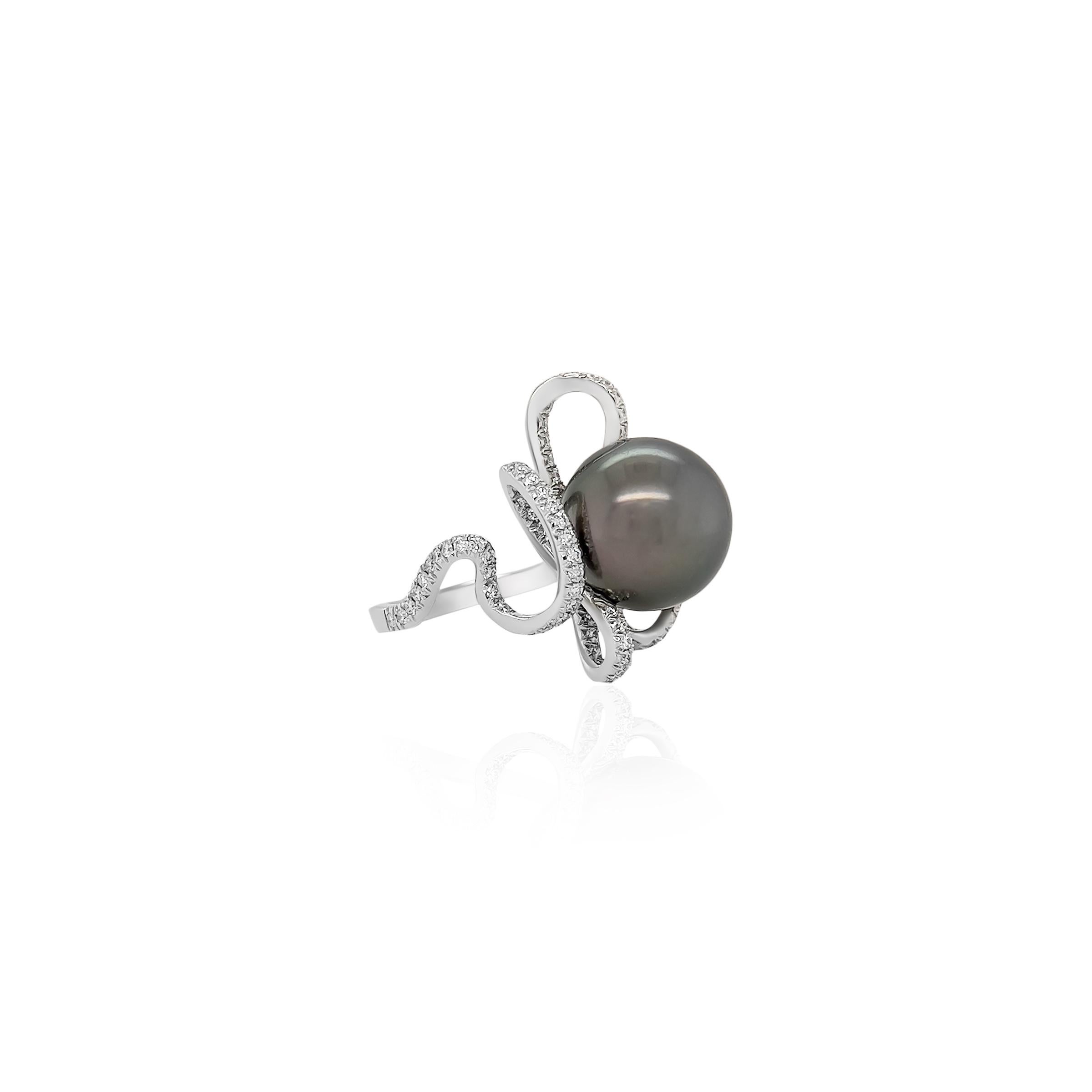 This ring embodies elegance and originality and showcases a mesmerizing spiral design, meticulously encrusted with natural diamonds. At the heart of the ring lies a beautiful grayish black 15mm Tahitian Pearl. All set in 18k white gold. 

The