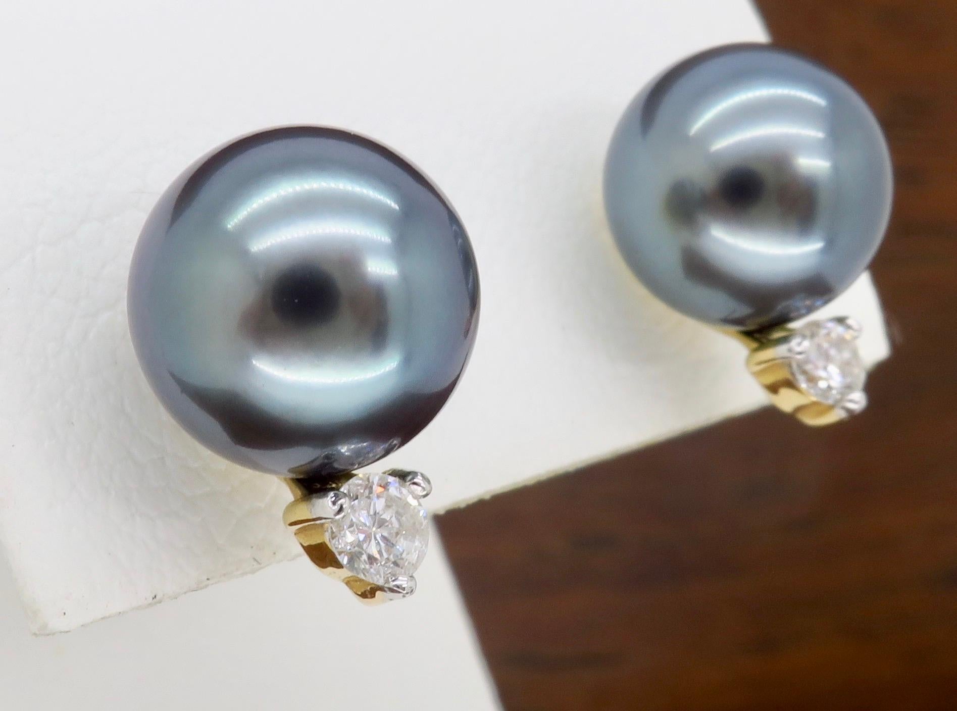 Classic pair of Tahitian Pearl & Diamond stud earrings. 

Gemstone: Tahitian Pearl & Diamond
Pearl Size: Approximately 9.2 MM 
Diamond Carat Weight: .20CTW
Metal: 14K Yellow Gold
Marked/Tested: “14K” “CPI