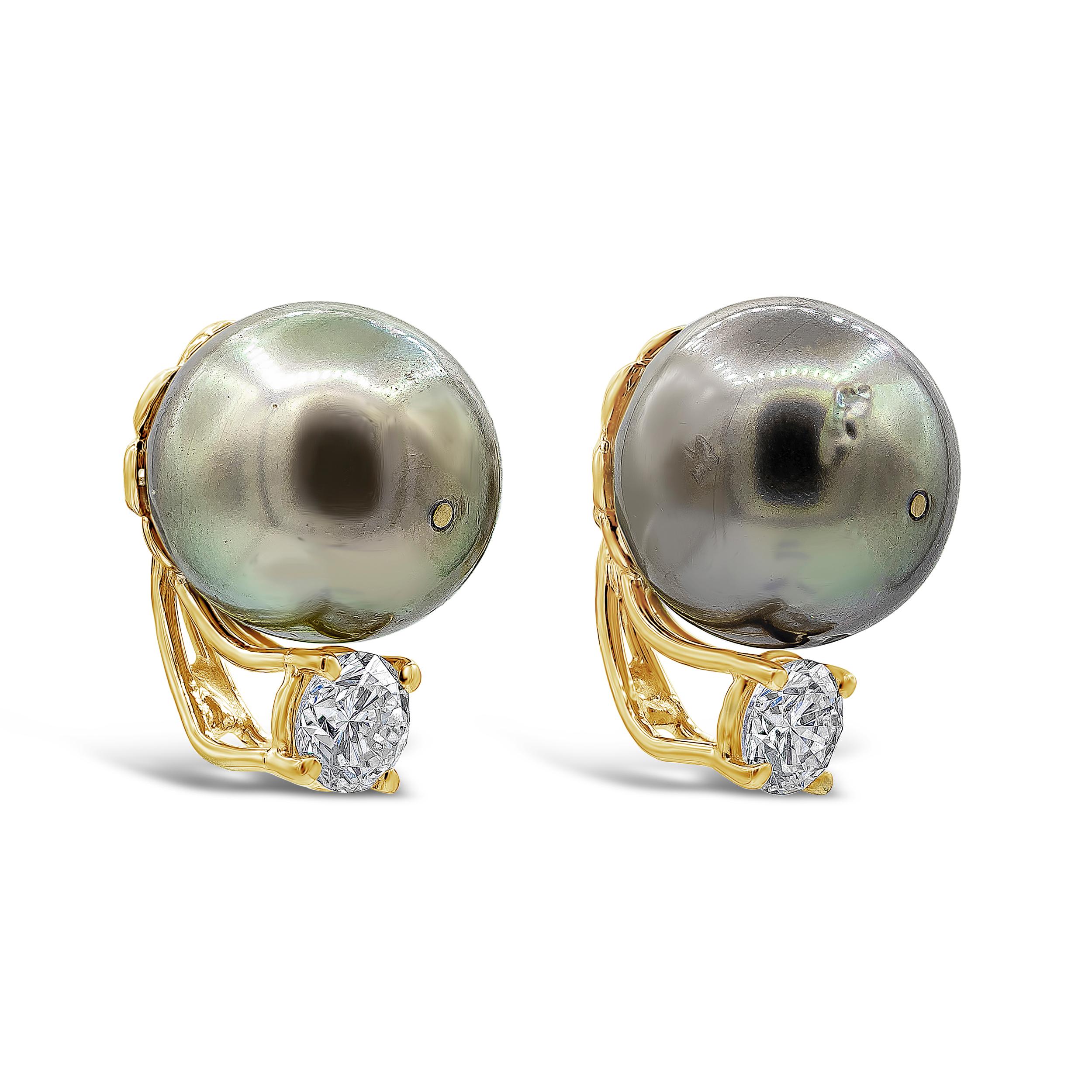A simple elegant pair of 12mm Tahitian pearl earrings accented by a single brilliant round diamond. Diamonds weigh 0.88 carats total. Made in 18K Yellow Gold

Style available in different price ranges. Prices are based on your selection. Please