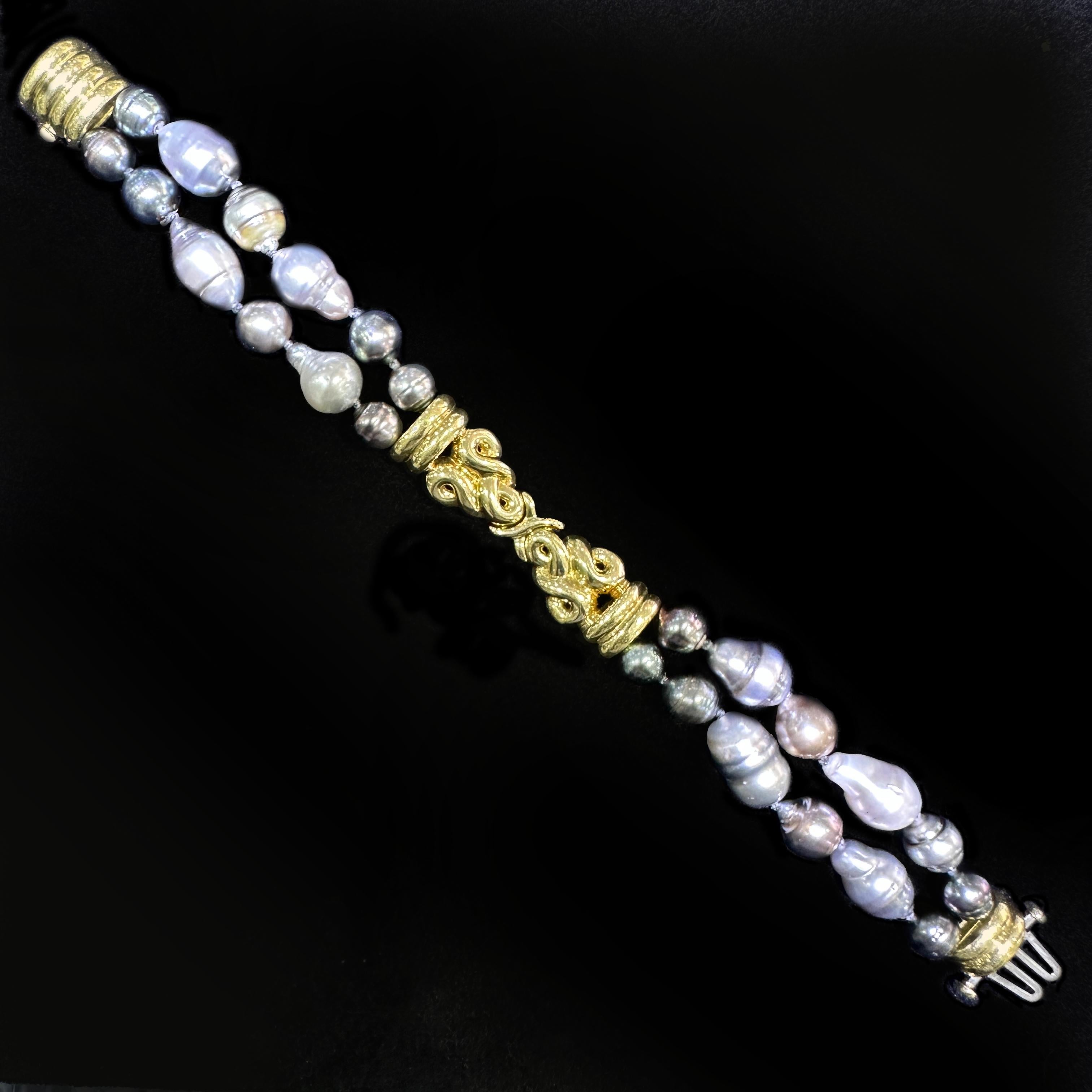 This bracelet was originally strung with strands of 8mm Akoya pearls.  It was pretty, but sort of boring and the pearls had a strong yellowish overtone we didn't much like.  

Rather than restringing with higher quality Akoyas, we decided to go for