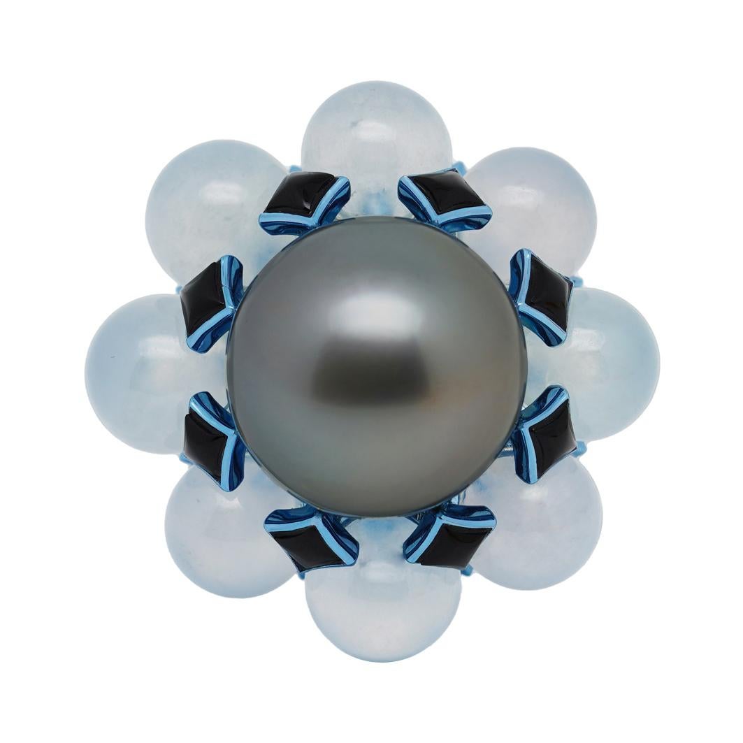 The White Grapes Temple Ring from 'The Garden of Myth Collection' by Austy Lee. This temple-like ring has a Tahitian Silver-grey Pearl surrounded by eight Burmese Type A Jadeites, which is translucent and very fine in texture. Designed with a high