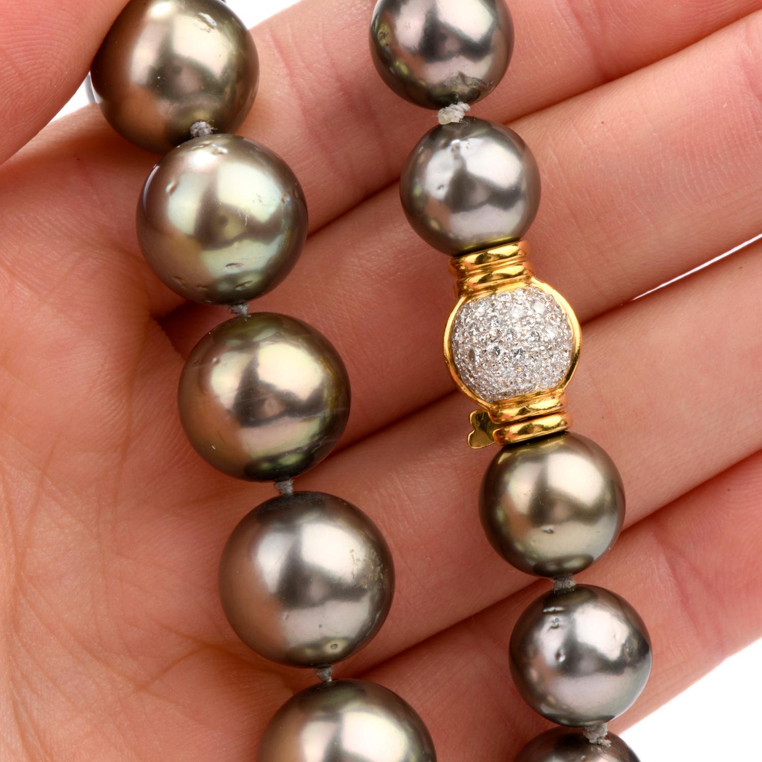 Classic and Elegant

This 20 Inch strand of genuine lustrous Tahitian Pearls tapers from 11 to 16mm.

Featured are 37 large Pearls and a diamond encrusted 18k gold ball clasp

all strung and knotted between.

Diamonds weigh appx. .90 carats and are