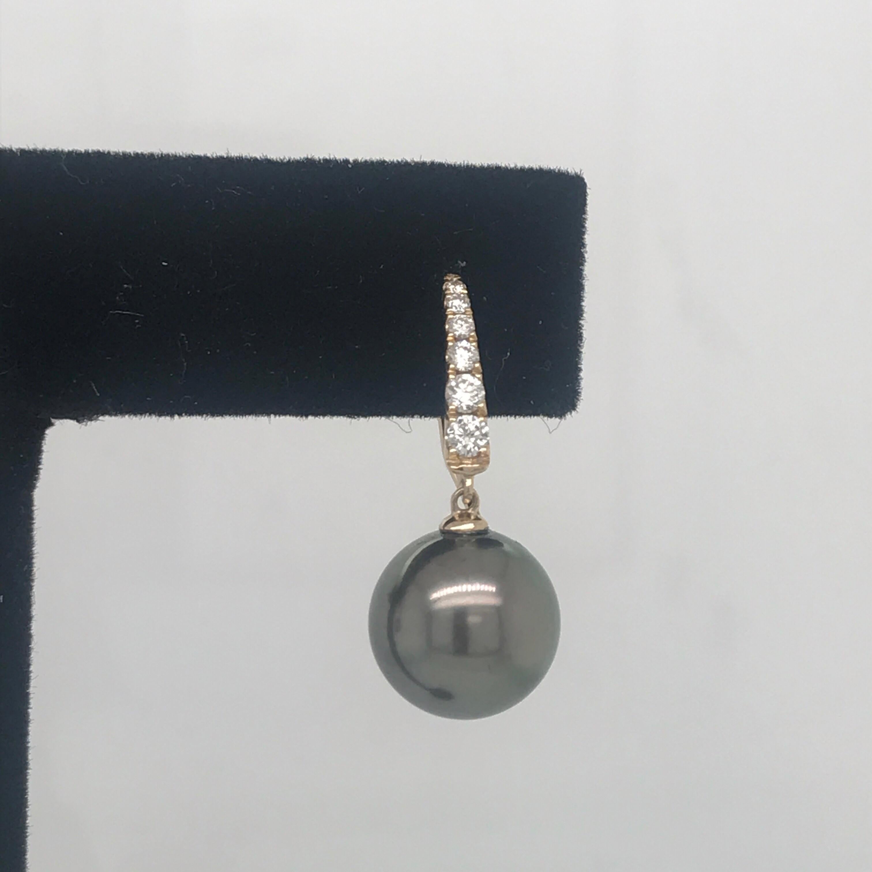 14K Yellow gold drop earrings featuring two Tahitian grey pearls measuring 1-11 mm and diamond tops weighing 0.30 carats.
Color G-H
Clarity SI