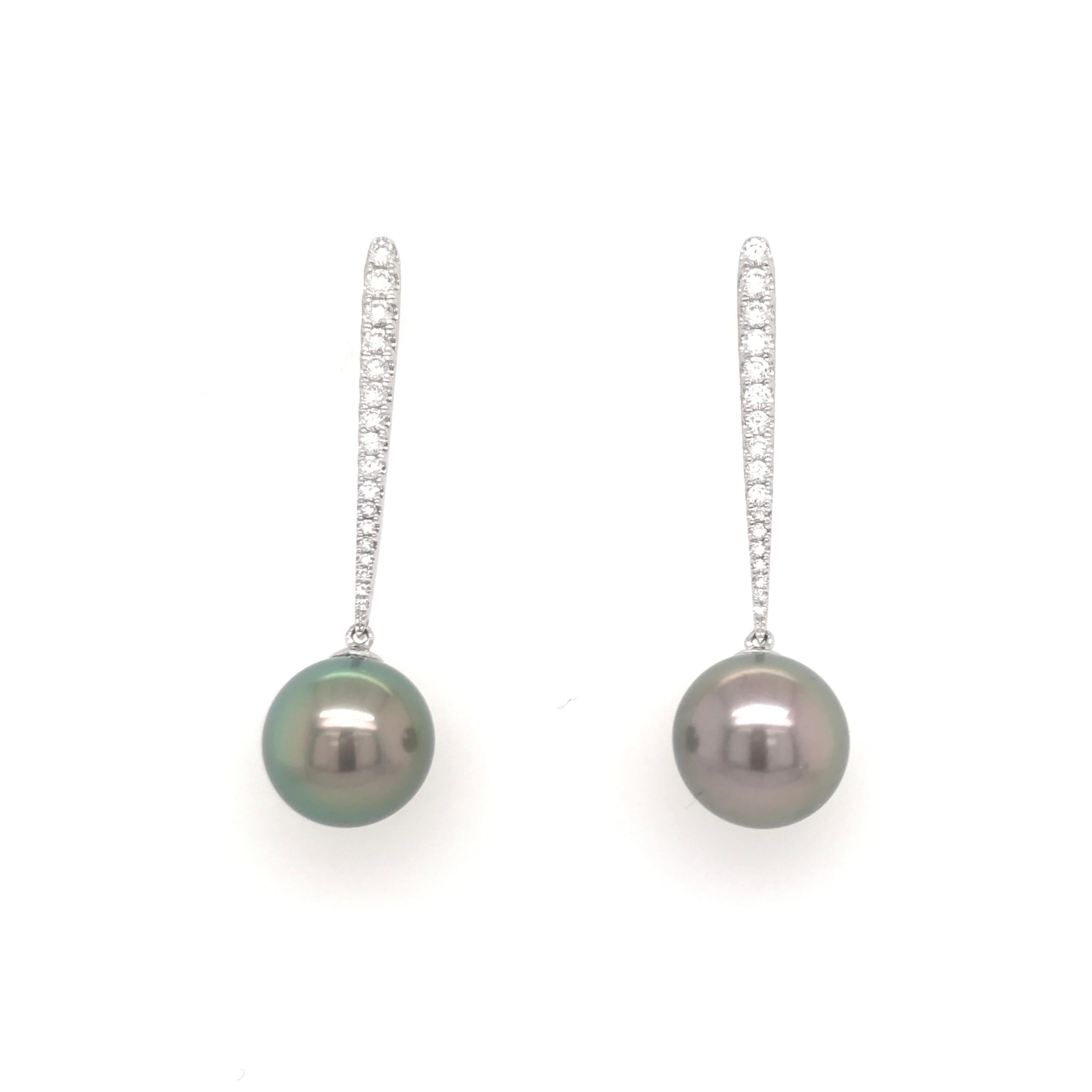 18K White Gold drop earrings featuring two Tahitian pearls measuring 10-11 mm with a diamond bar weighing 0.43 carats.
Color G-H
Clarity SI

Comes in yellow and white gold and can customize any color pearl! 