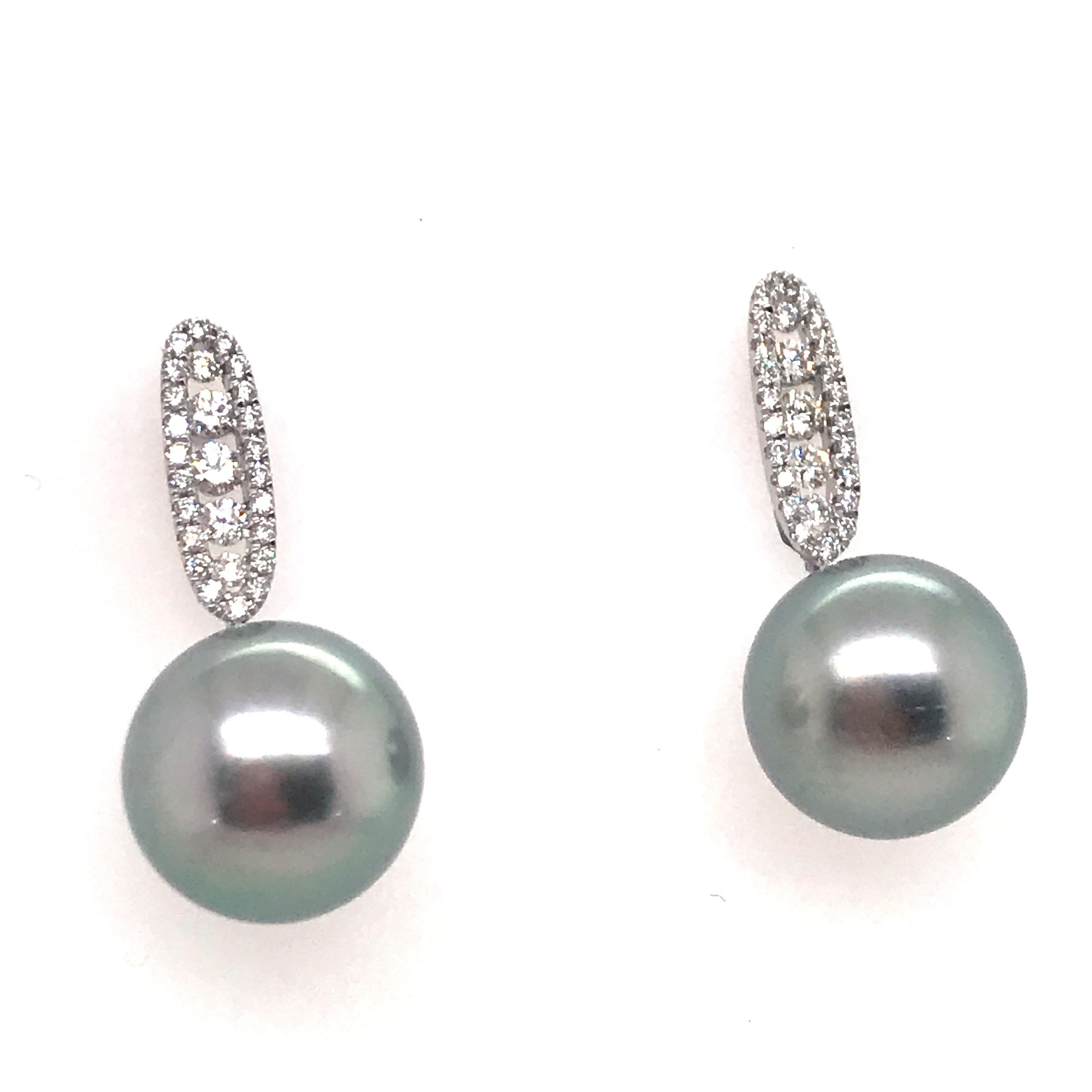 18K White gold drop earrings featuring two Grey Tahitian pearls measuring 11-12 mm and 54 round diamonds weighing 0.45 carats.