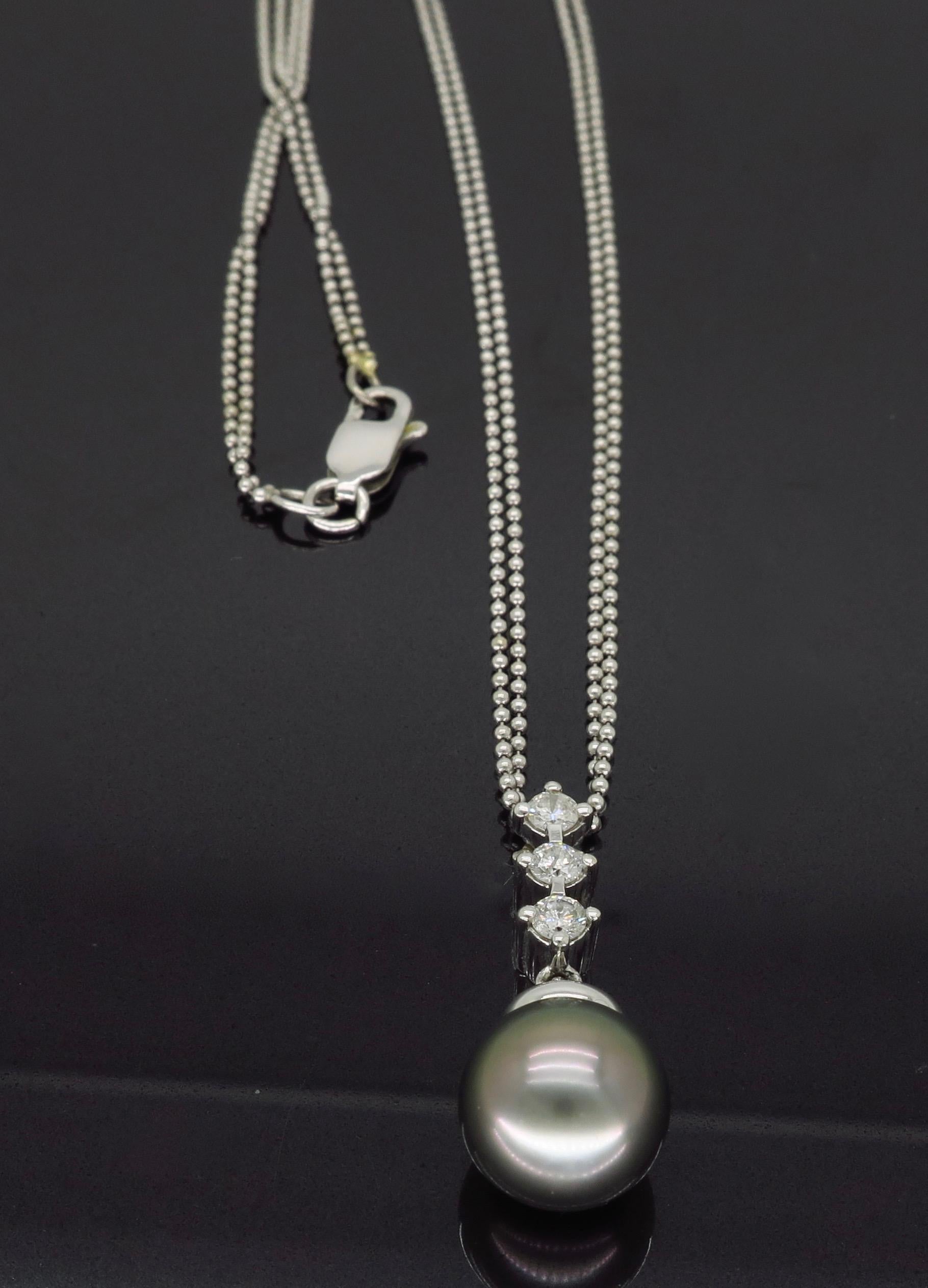 Pearl and diamond drop necklace crafted in 14k white gold.

Gemstone: Tahitian Pearl & Diamond
Gemstone Carat Weight: Approximately 9.45mm
Diamond Carat Weight: Approximately .21ctw
Diamond Cut:  Round Brilliant Cut
Color: Average G-H
Clarity: