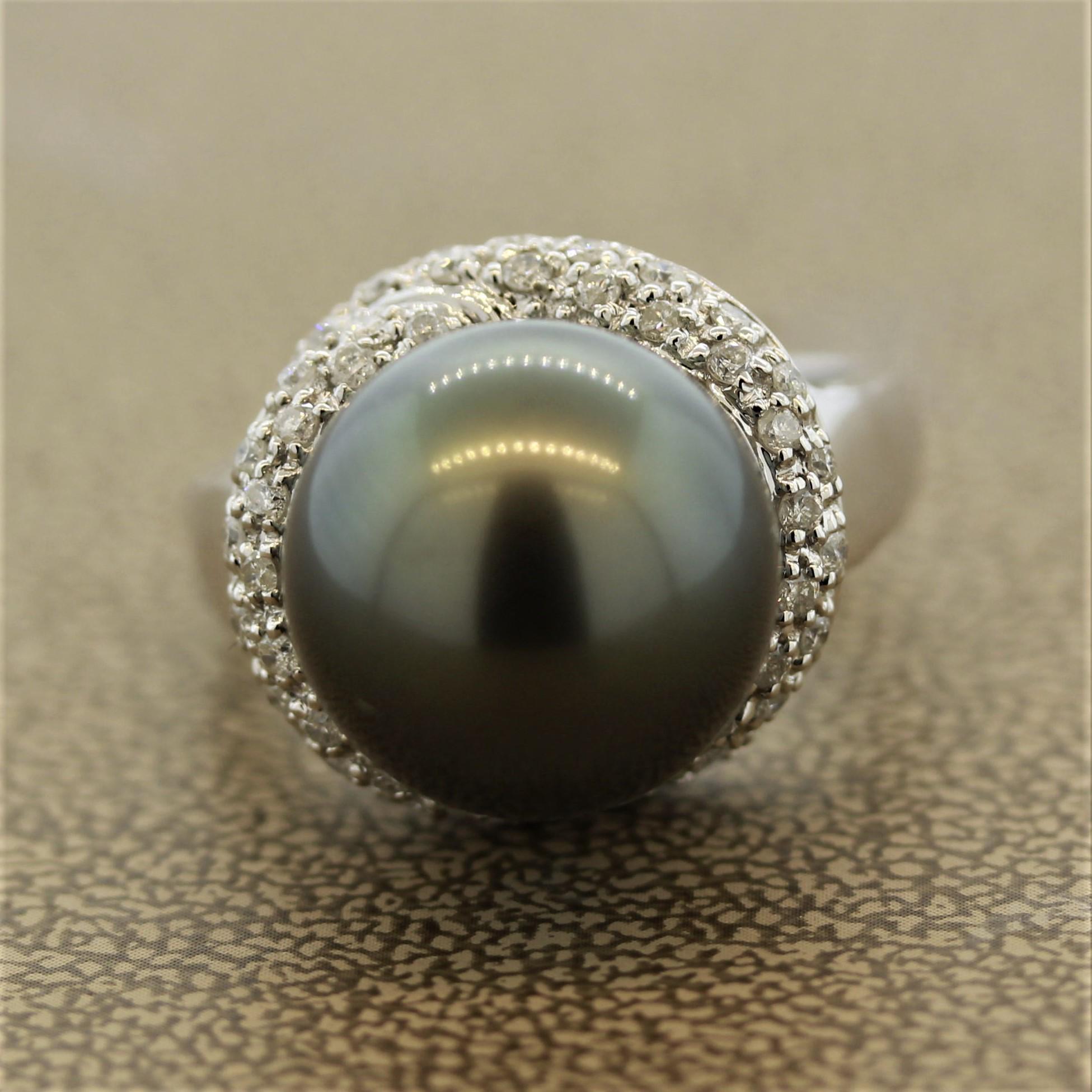 This ring features a stunning Tahitian pearl as the center stone and adding charm to it are 0.21 carats of diamonds that are set below the pearl like an overlapping ribbon.

The ring is made of 14K White Gold.

Ring Size: 7