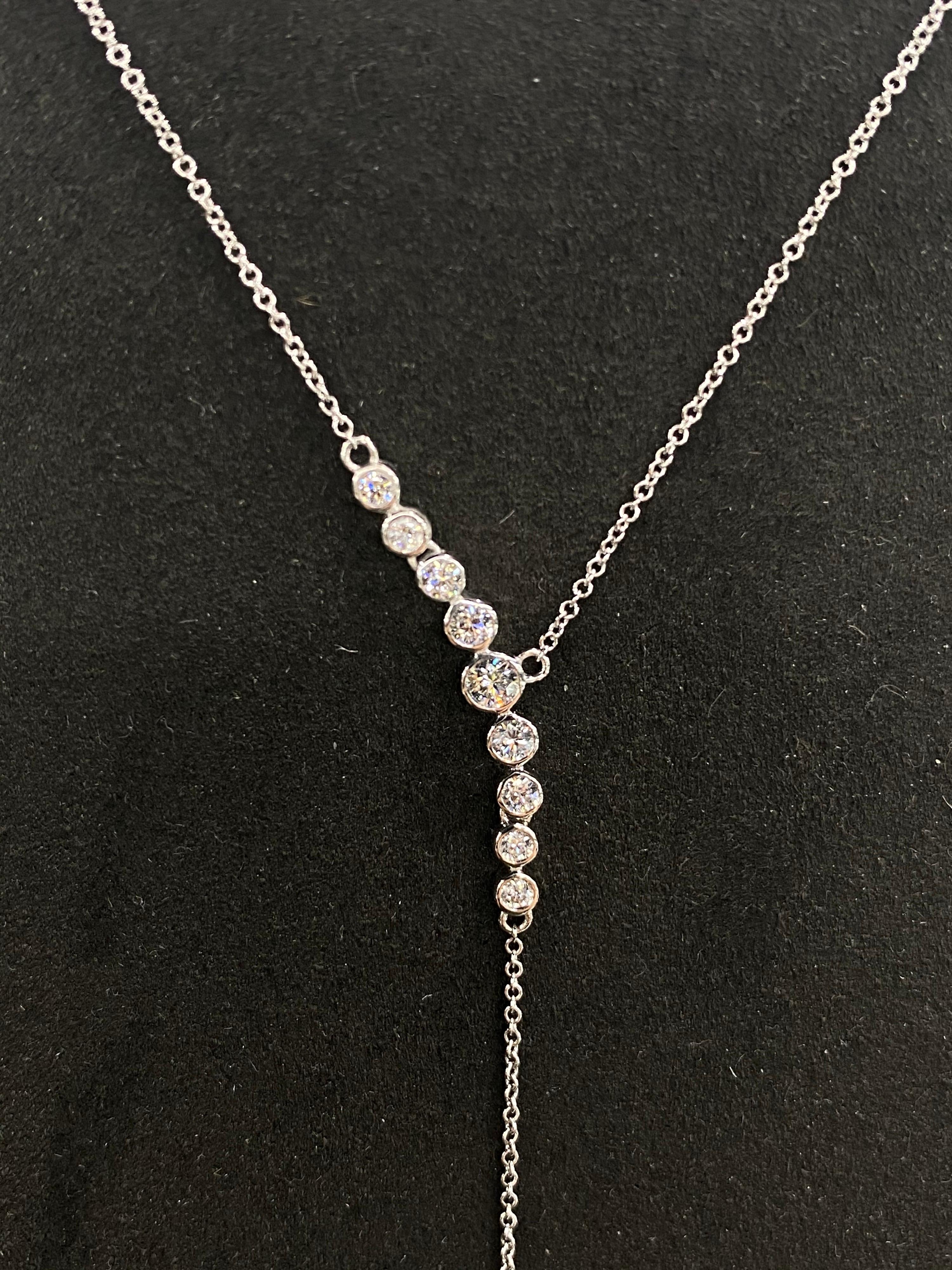 18K White gold lariat necklace featuring 8 round brilliants weighing 0.31 carats with a grey Tahitian pearl drop measuring 13-14 mm and two round diamonds weighing 0.20 carats.
Color G-H
Clarity SI

Pearl can be changed to a Pink, White or White