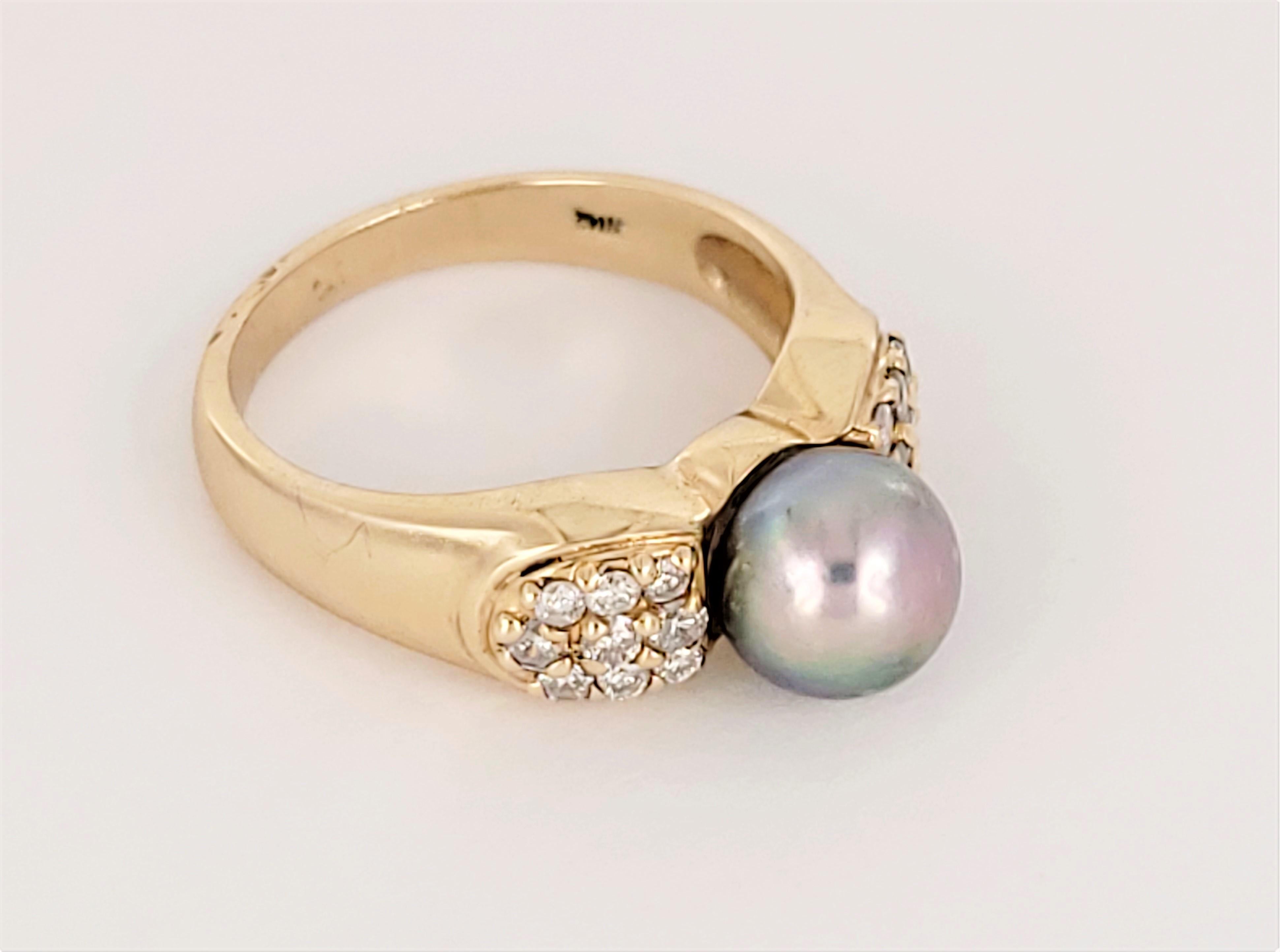 A sophisticated & timeless design featuring a Tahitian pearl and diamond accents. 

Weight: 4.9g
Size: 6.25
Materials: 14k yellow gold, diamonds & Tahitian pearl