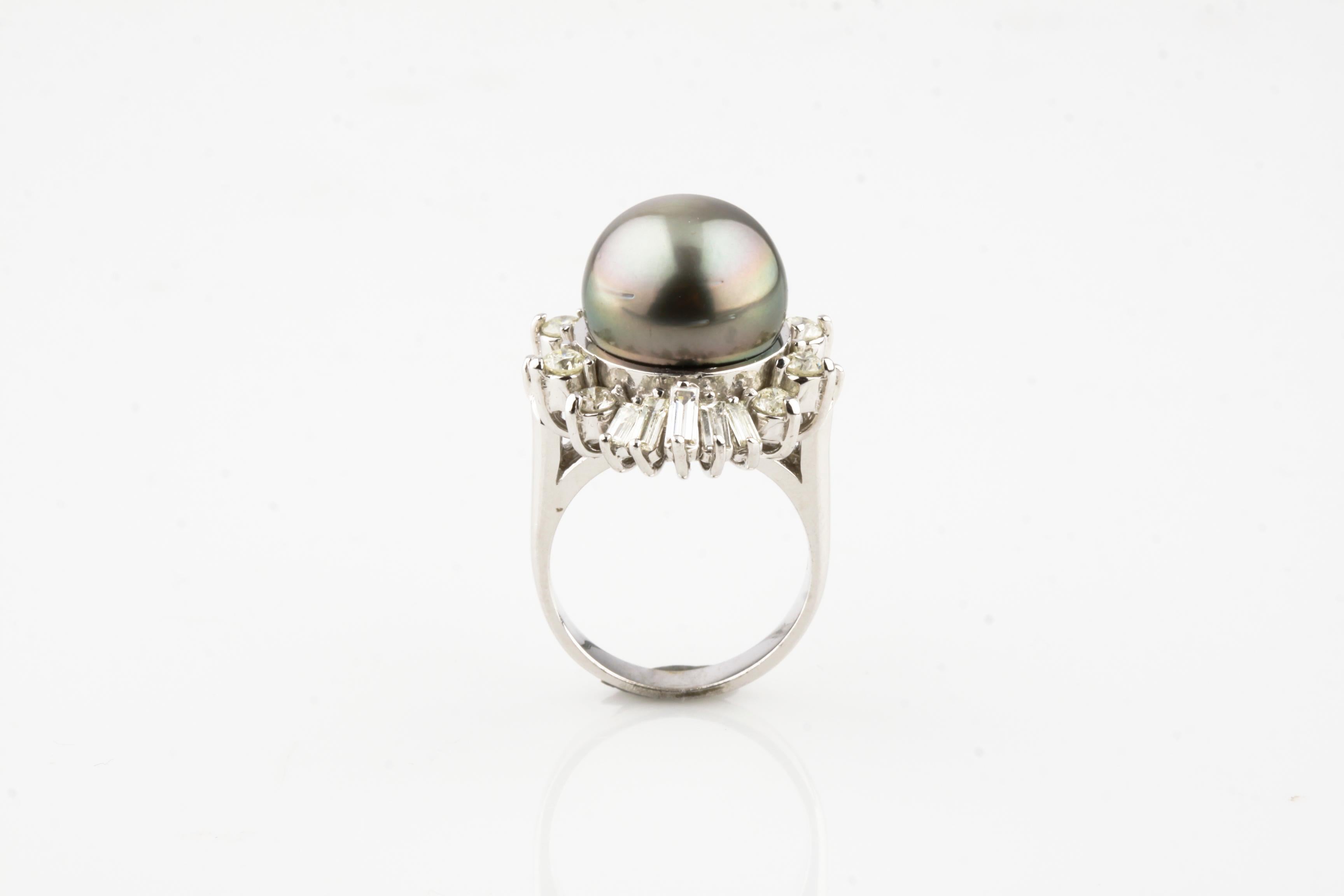 One electronically tested 14KT white gold ladies cast Tahitian cultured pearl & diamond ring with a bright polish finish. 
Size 6
Featuring a Tahitian cultured pearl set within a bezel of diamonds, supported by split shoulders, completed by a three