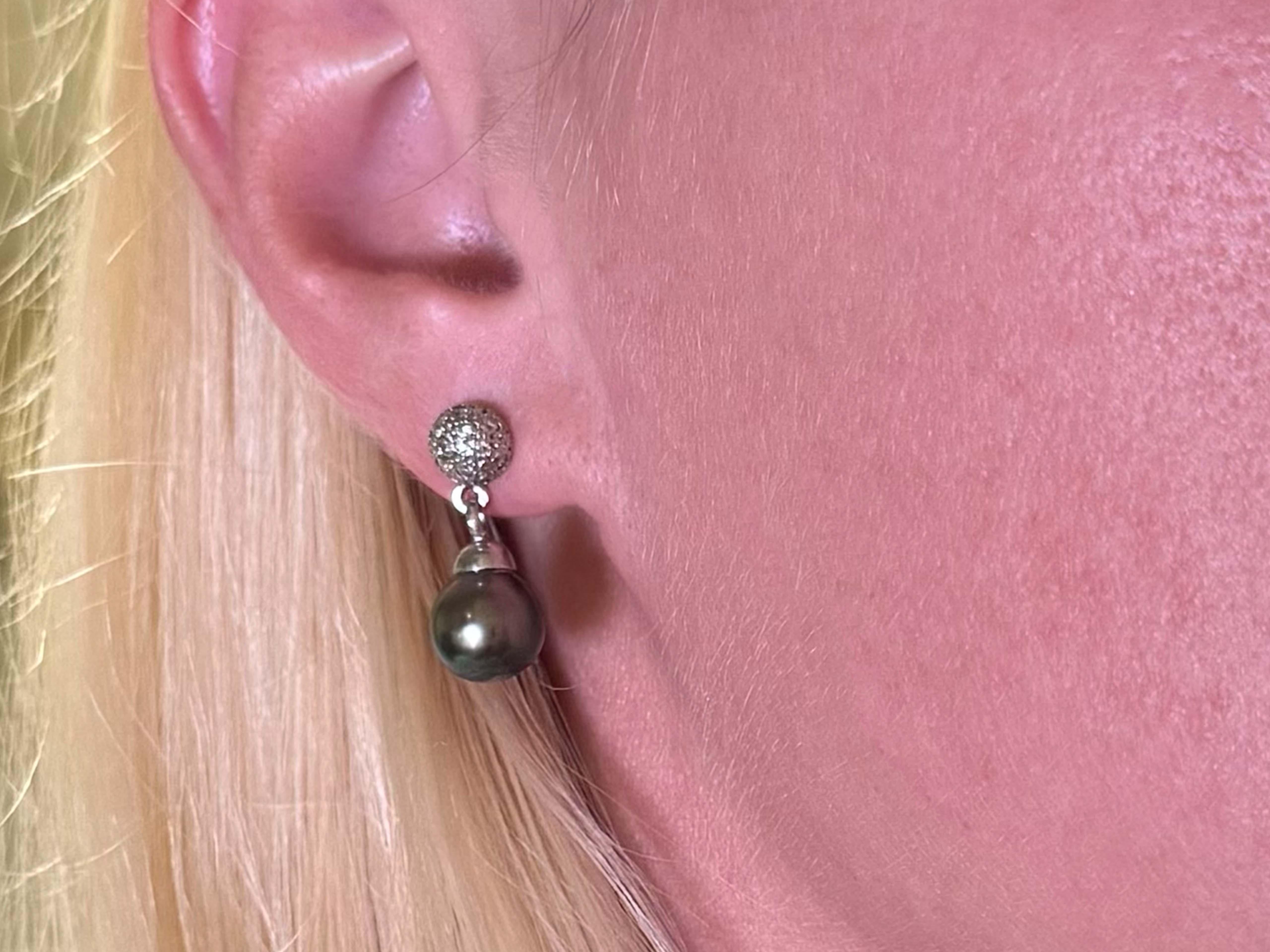 These stunning Tahitian pearls feature a peacock color with stunning blue green and purple hues.

Earrings Specifications:

Metal: 14k White Gold

Earring Diameter: 0.90