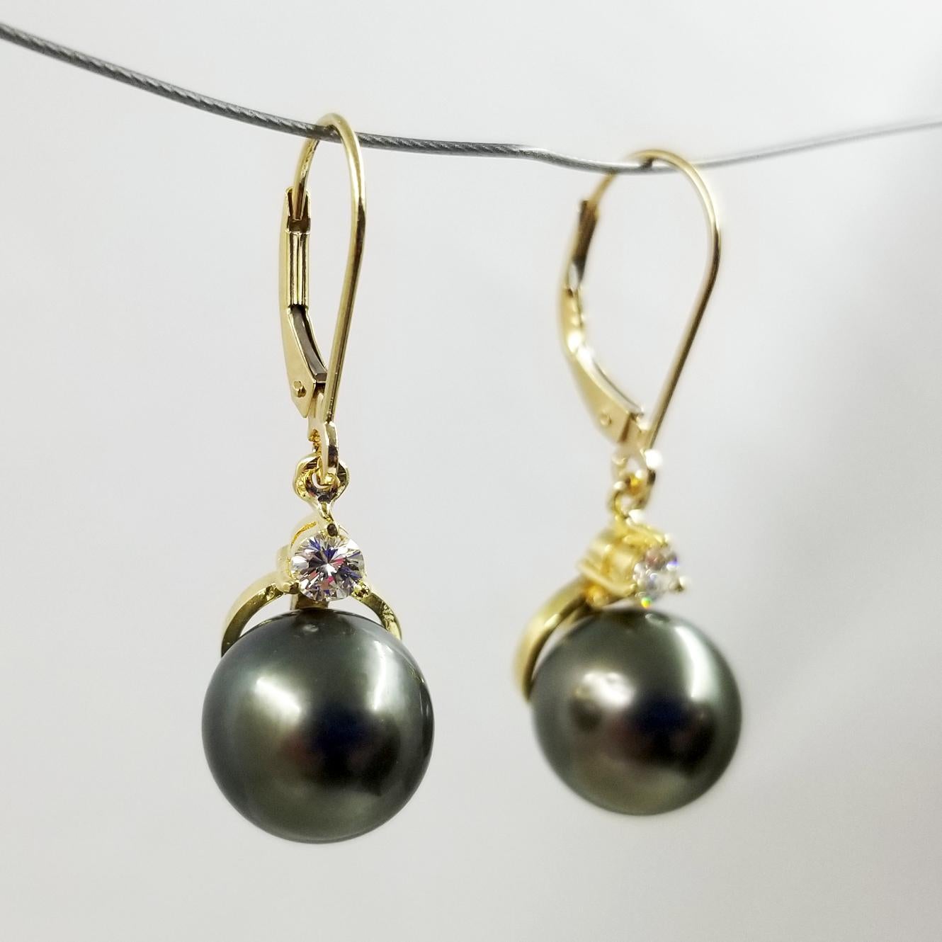 18 Karat Yellow Gold Tahitian South Sea Pearl Drop Earrings. 2 Gray Cultured Pearls Measure 10.4mm. 2 Diamonds Total 0.26 Carat. Finished Weight is 5.5 Grams.