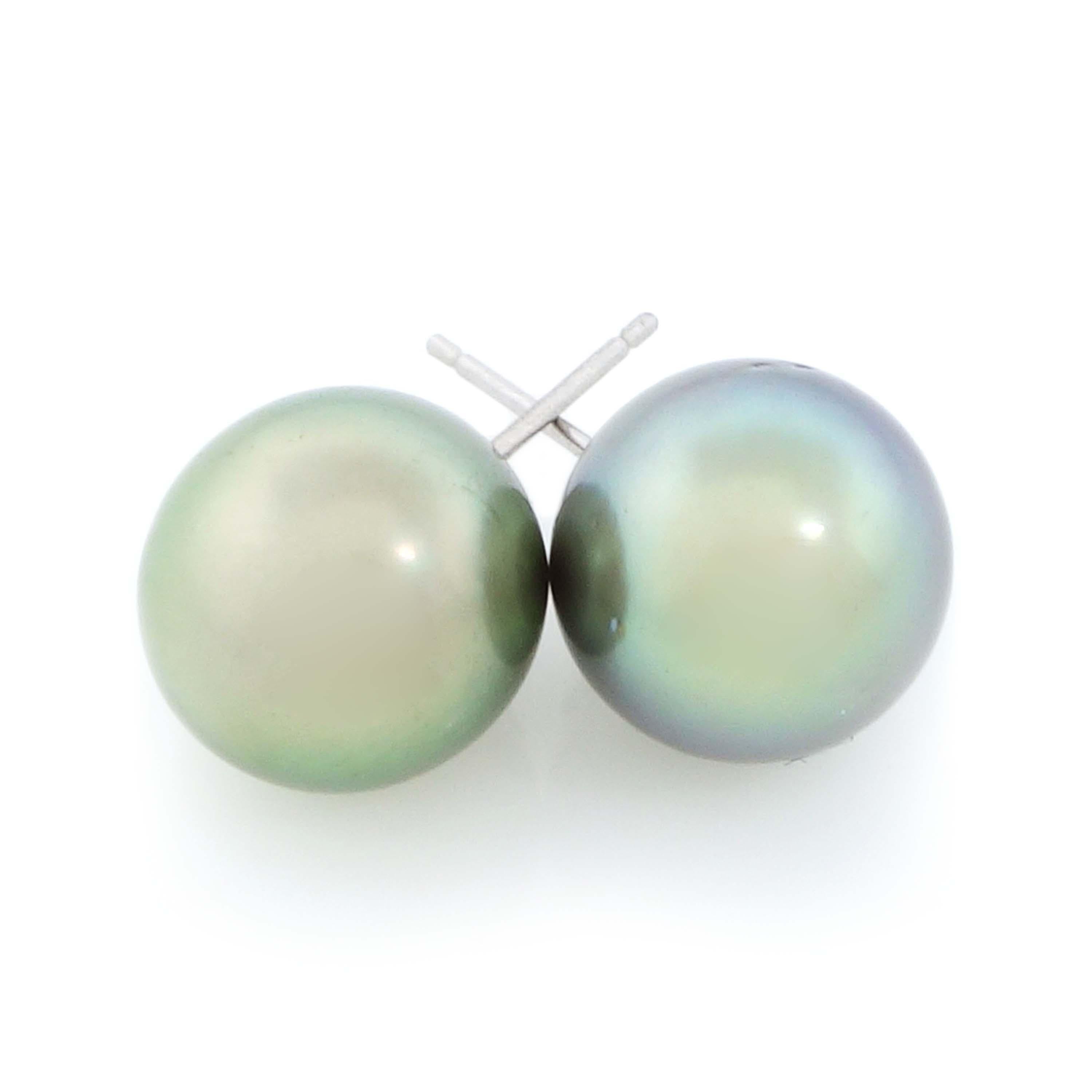 2 Tahitian pearls of about 9.75 to 10.00 mm set in 14k white gold earrings. Total weight of the earrings is approximately 3.20 grams.
