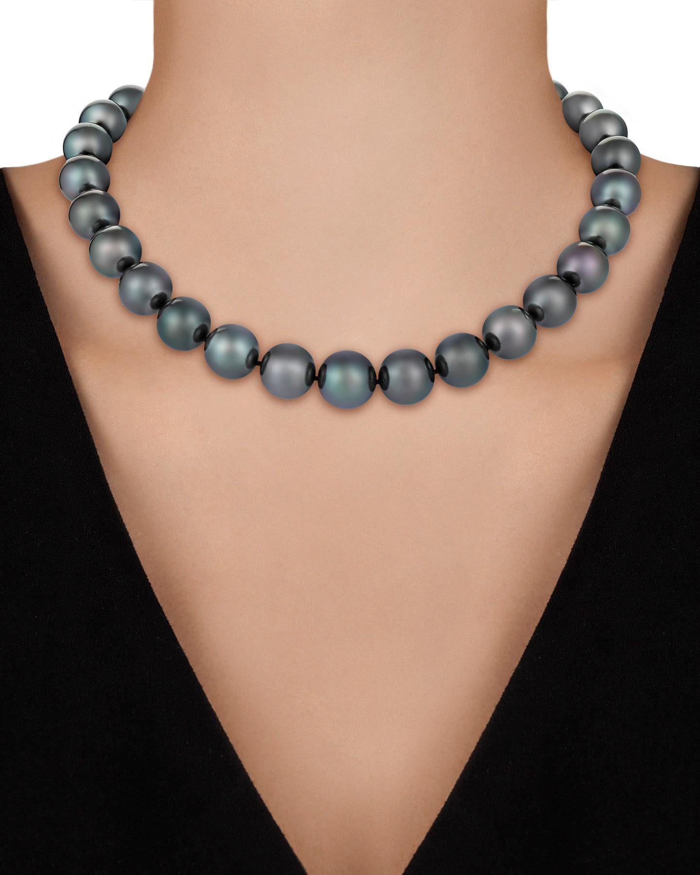 Displaying a rare silvery hue, the 29 Tahitian pearls in this classic necklace are perfectly matched. Each measuring 13mm, their color and eye-catching luster truly set them apart as rare, covetable treasures. Pearls such as these that hail from the