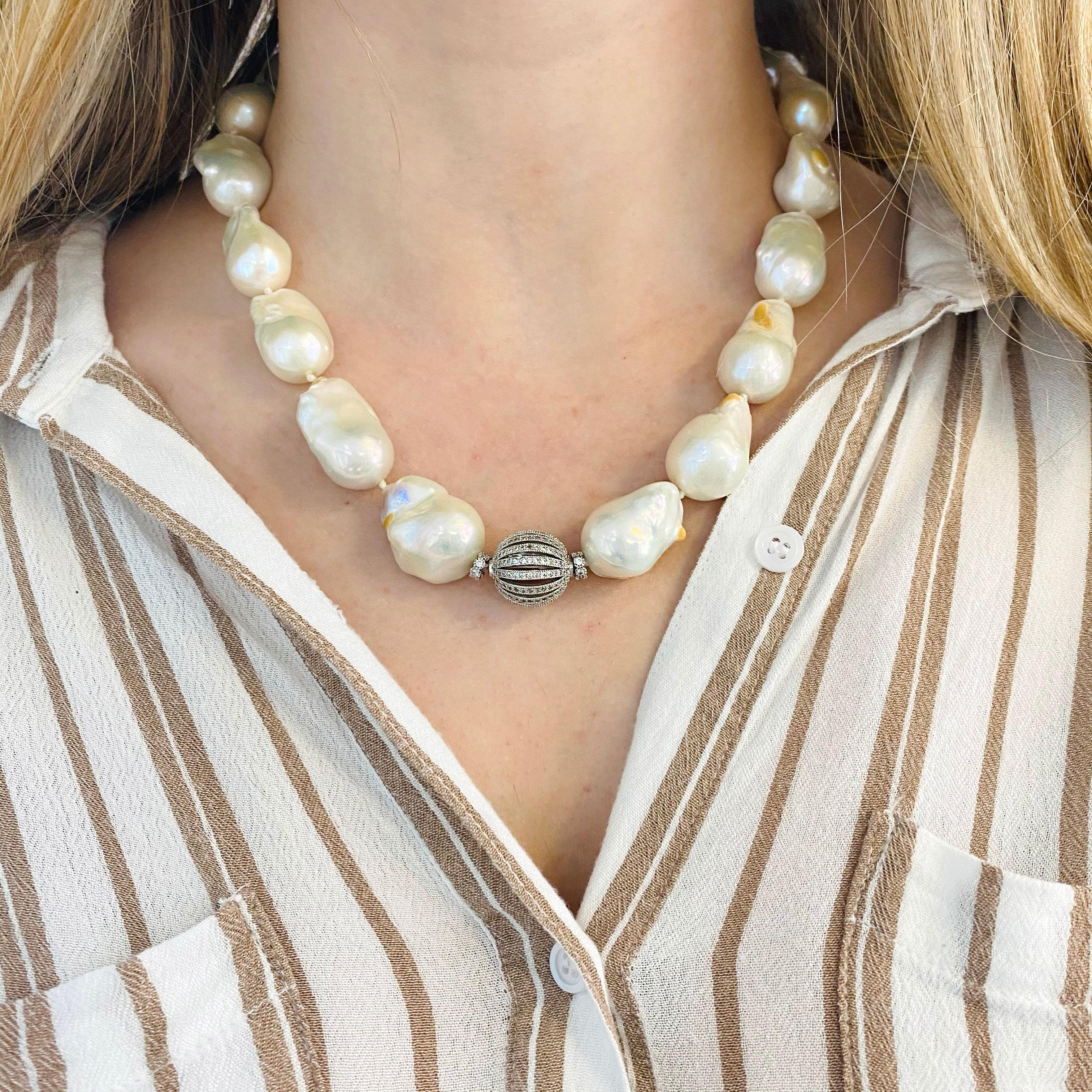 These baroque Tahitian pearls are white in color and knotted between each with a sterling silver adjustable chain and clasp.  The pearls are large 20 x 12 millimeters and make a great statement piece!  Each pearl is unique in shape with varied nacre