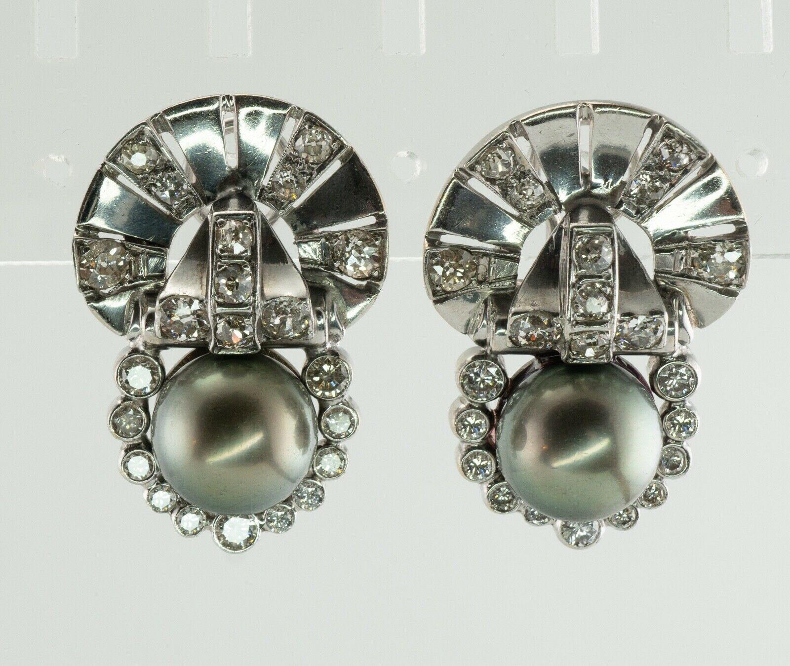 This absolutely stunning pair of earrings is finely crafted in solid 14K White Gold (carefully tested and guaranteed).
Two natural cultured Tahitian pearls with good luster are 11.06 mm and 11.10 mm. 
Each earring holds 11 old mine cut diamonds on