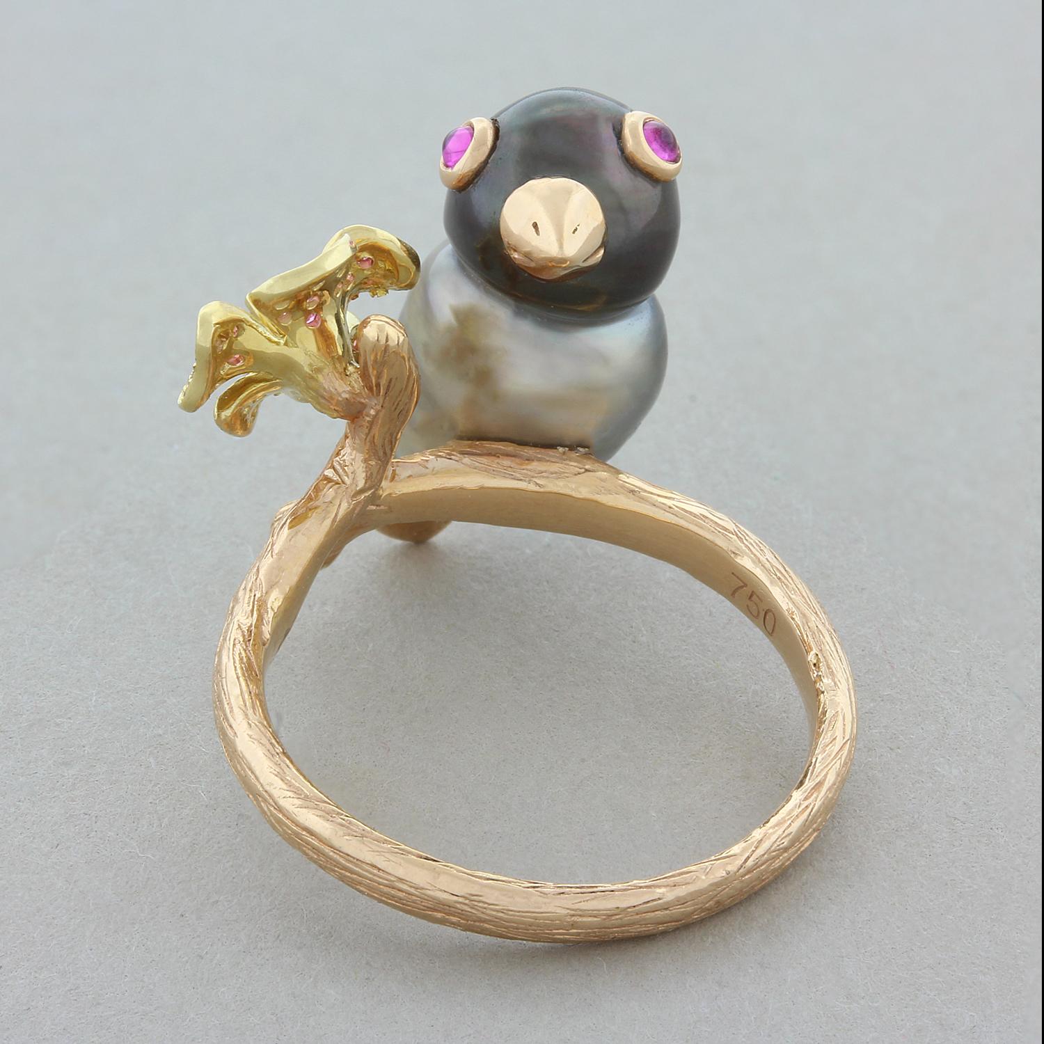 A baroque Tahitian pearl with 0.05 carats of rubies makes this birdie sitting on a branch of 18K rose gold. The branch also holds a pretty flower with 0.11 carats of pink sapphires and a 0.04 carat diamond in the center. A unique and cute