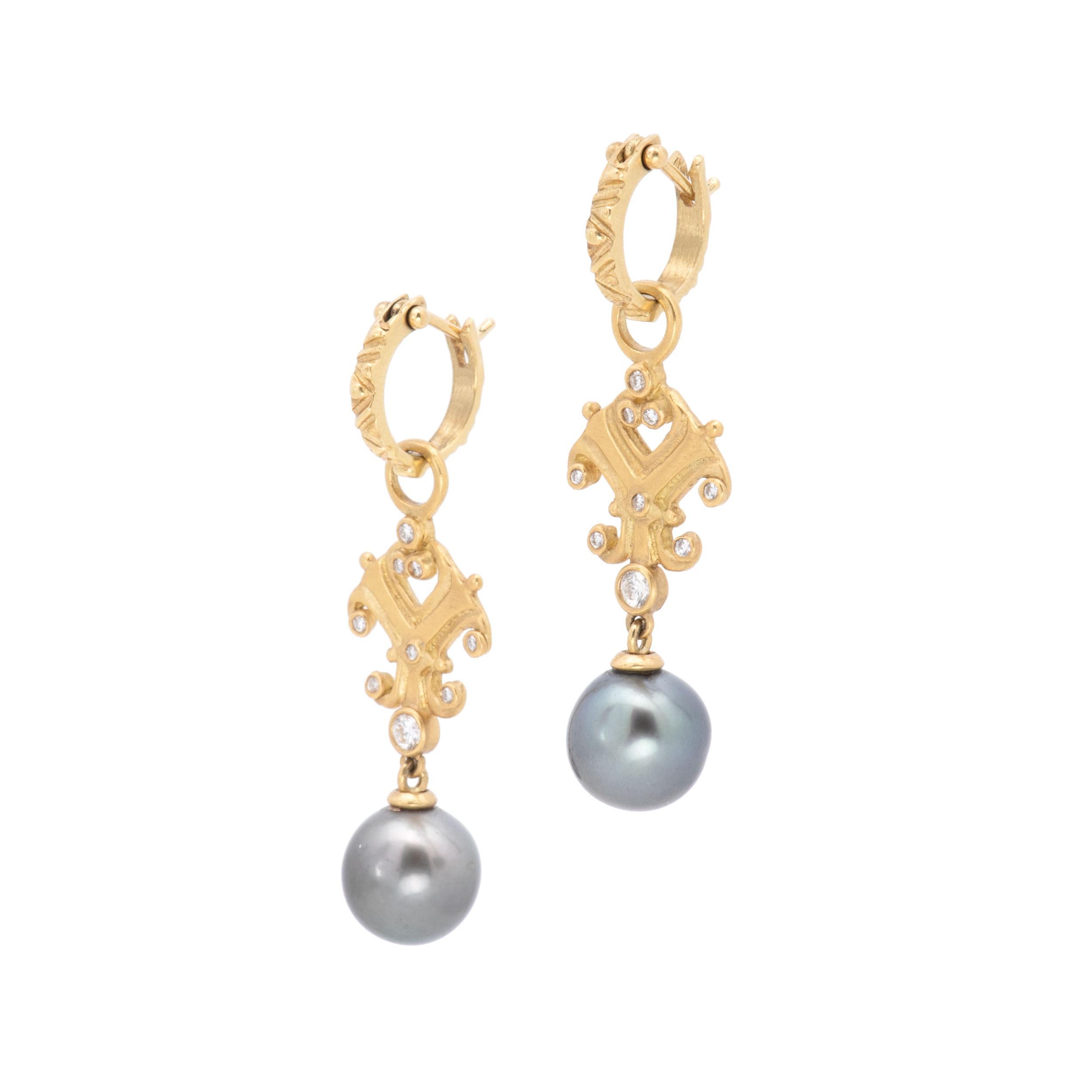 Treasures from the sea... 11-11.5mm cultured Tahitian Pearl Drop Scroll Earrings twinkle with white diamonds and are hand crafted in our studio of 18k gold. Capped in 18k gold, grey-black Tahitian pearls are suspended from graceful gold scrolls set