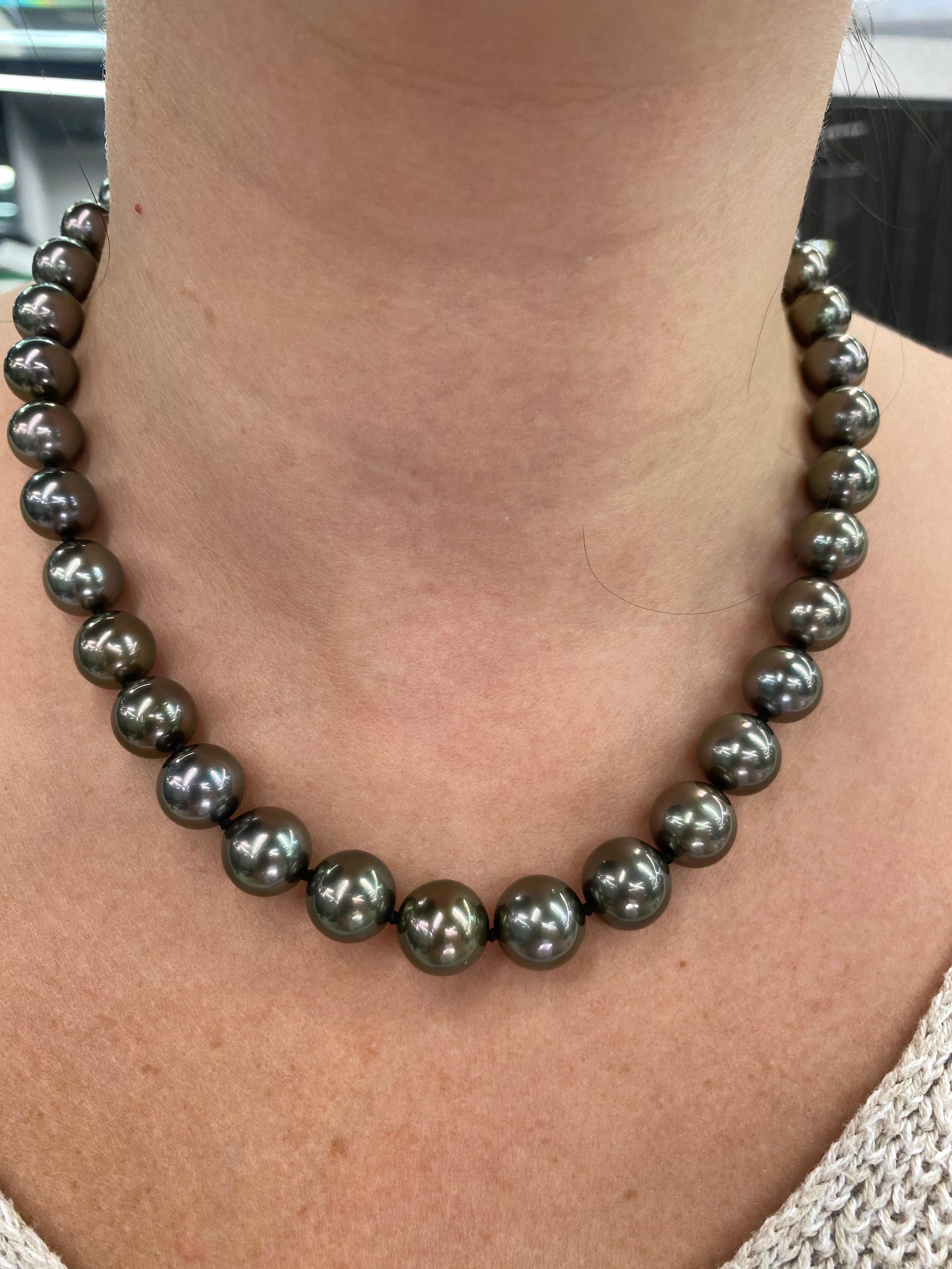 Perfectly matched pearl strand necklace featuring 37 Tahitian pearls measuring 10-12 mm with a high polish ball clasp in 14K White Gold. 

Pearl quality: AAA
Pearl Luster: AAA Excellent
Nacre : Very Thick

Strand can be made to order, shortened or