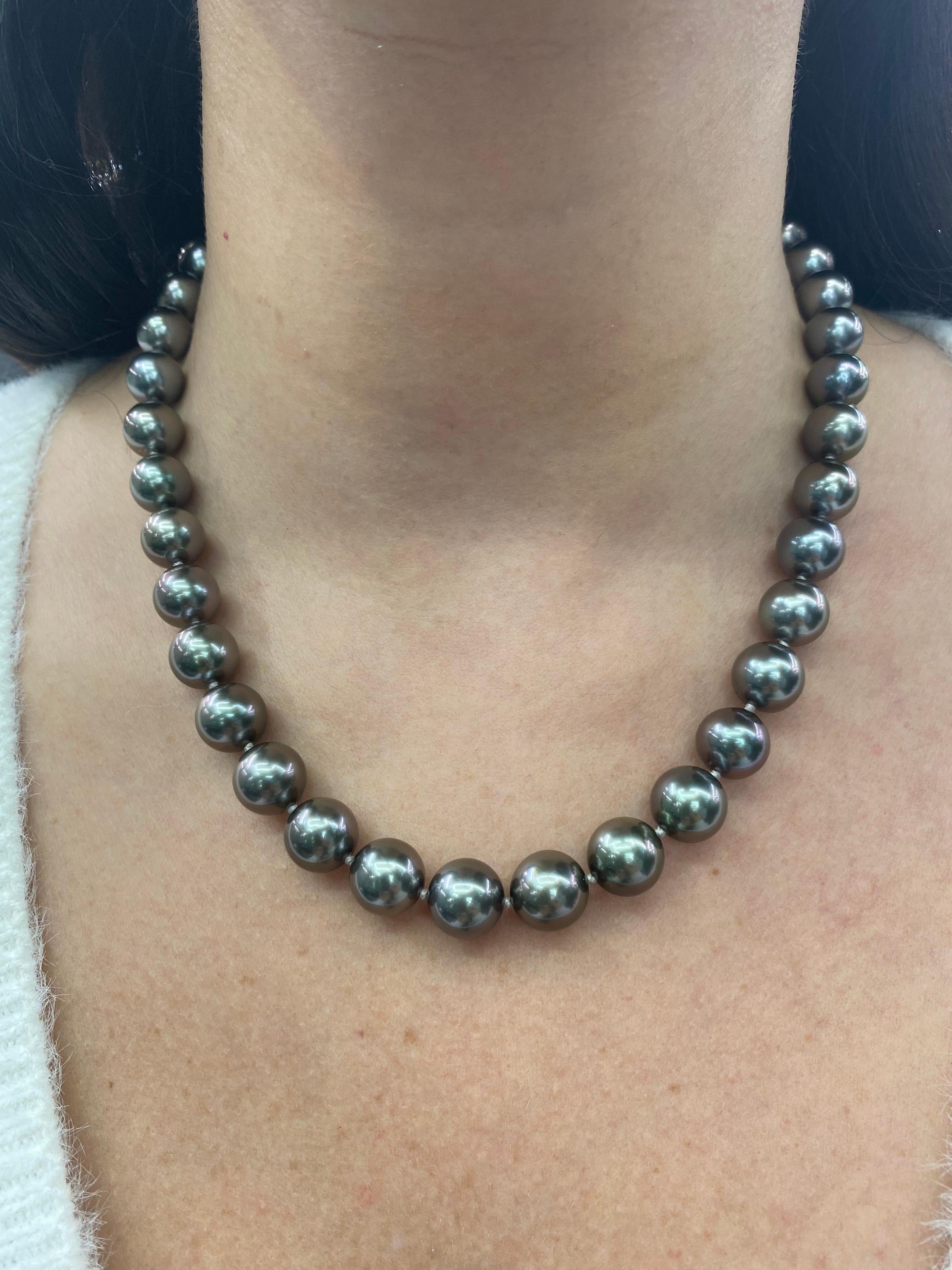 Perfectly matched pearl strand necklace featuring 39 Tahitian pearls measuring 10-11.3 mm with a high polish ball clasp in 14K White Gold. 

Pearl quality: AAA
Pearl Luster: AAA Excellent
Nacre : Very Thick

Strand can be made to order, shortened or