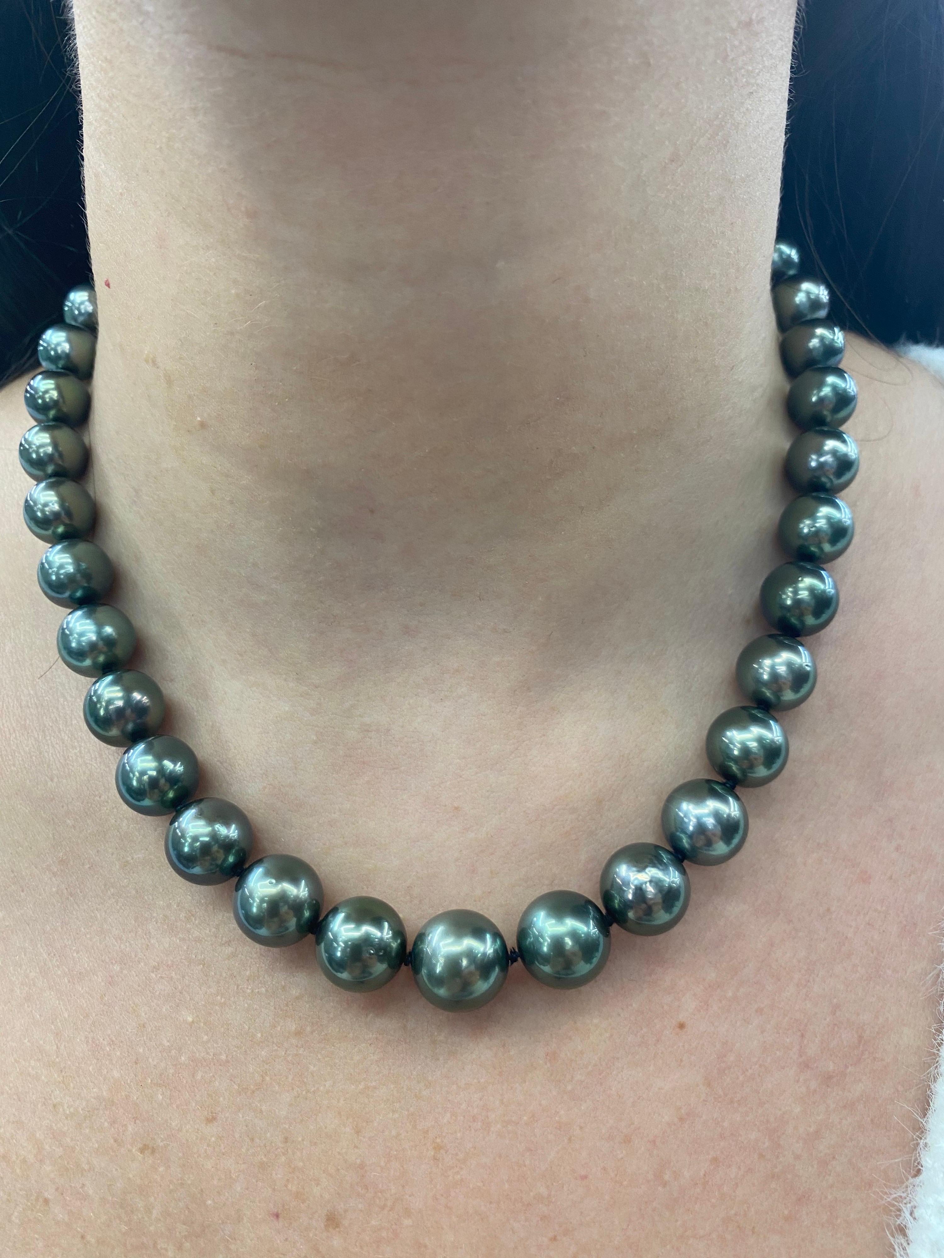 Perfectly matched pearl strand necklace featuring 37 Tahitian pearls measuring 10-12.6 mm with a high polish ball clasp in 14K White Gold. 

Pearl quality: AAA
Pearl Luster: AAA Excellent
Nacre : Very Thick

Strand can be made to order, shortened or