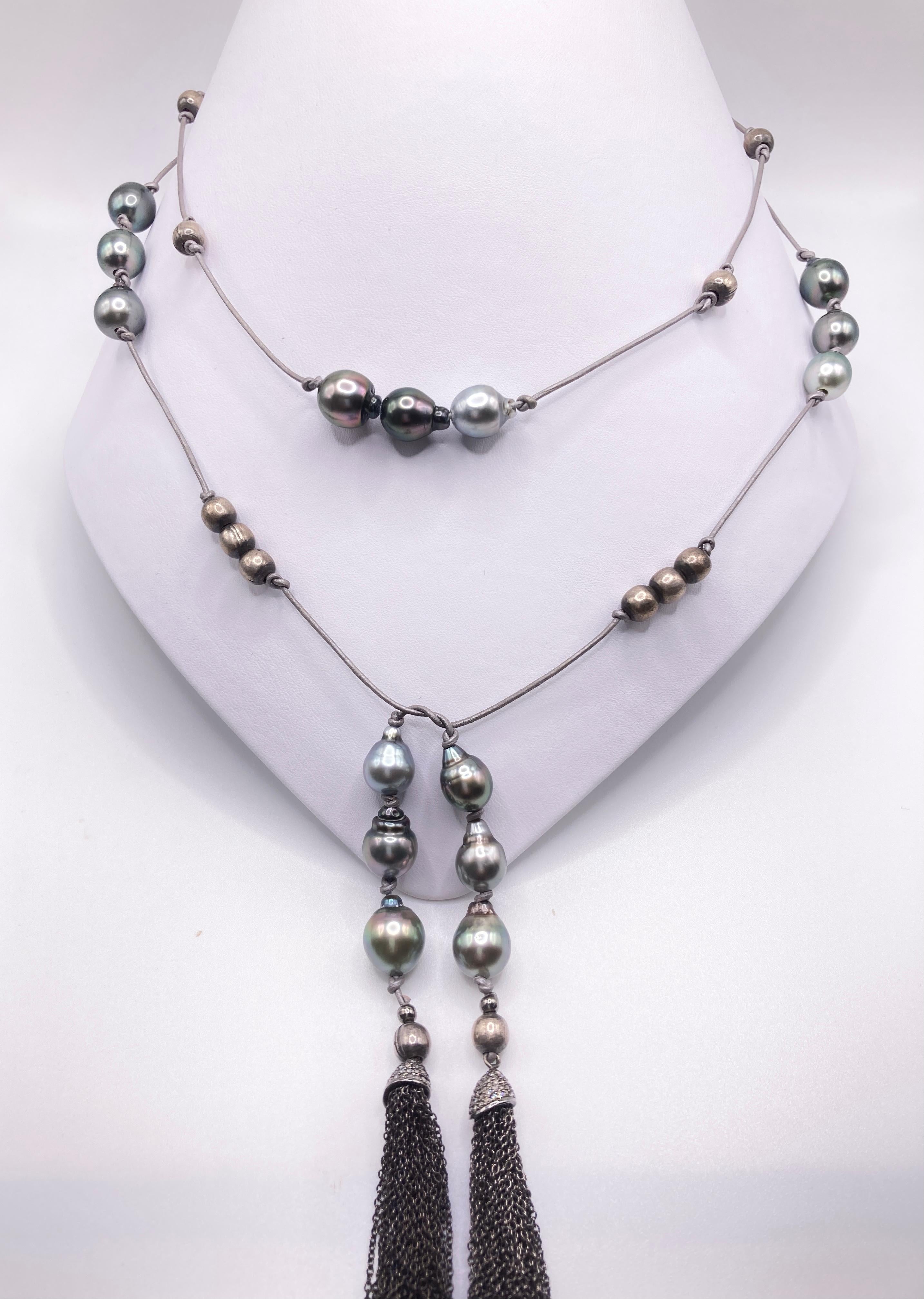 15 genuine Tahitian Pearls and silver beads are precisely mounted on leather to have three pearls in the front of the neck where the second layer that you tie below have also three pearls on each side and two diamond tassels to finish the piece. The