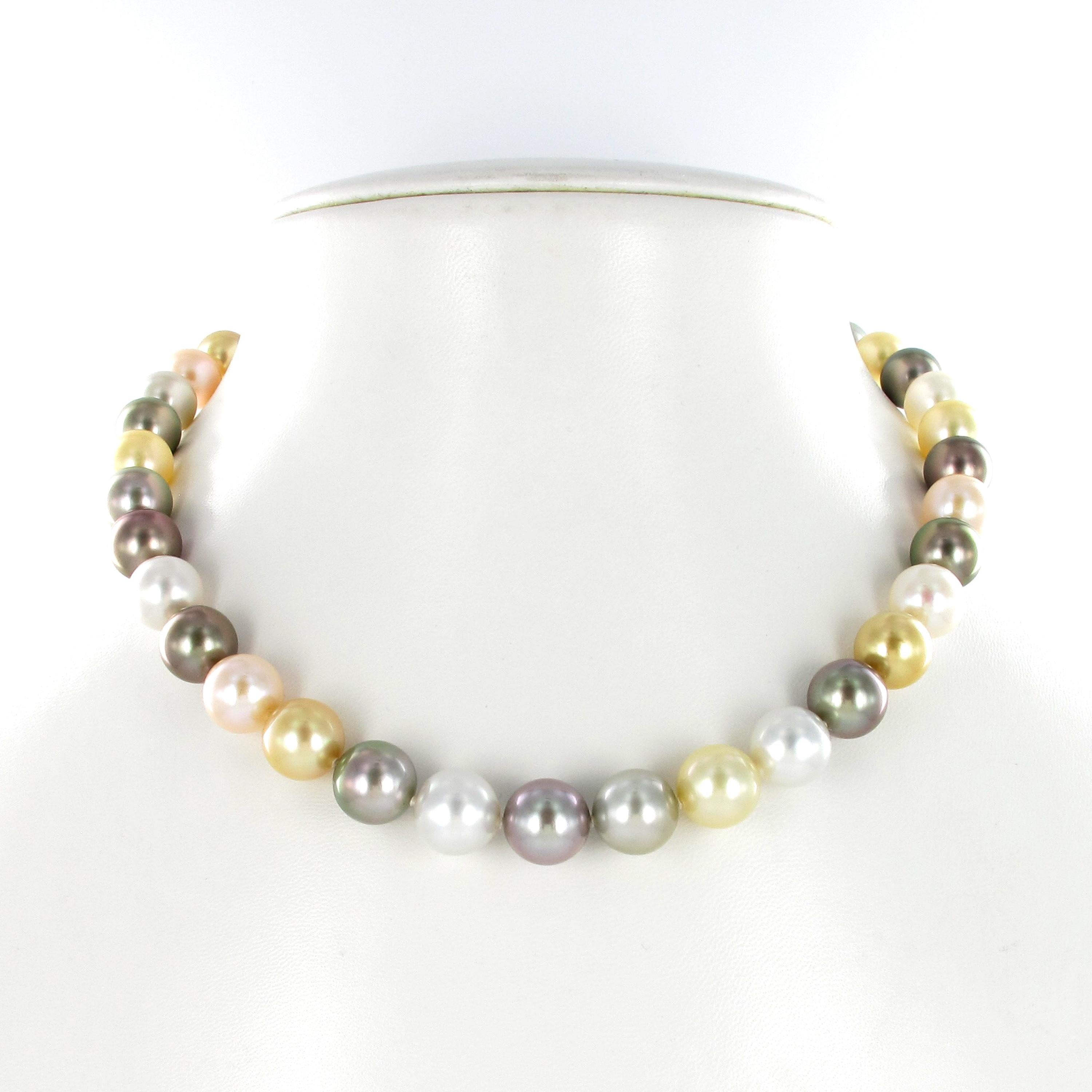 This colorful necklace features 39 round Tahitian, South Sea, and Freshwater cultured pearls graduating from 9.7 mm to 11.9 mm. With an elegantly hidden bayonet/tube clasp in 18 karat yellow gold.

The pearls are of perfectly round shapes, with a