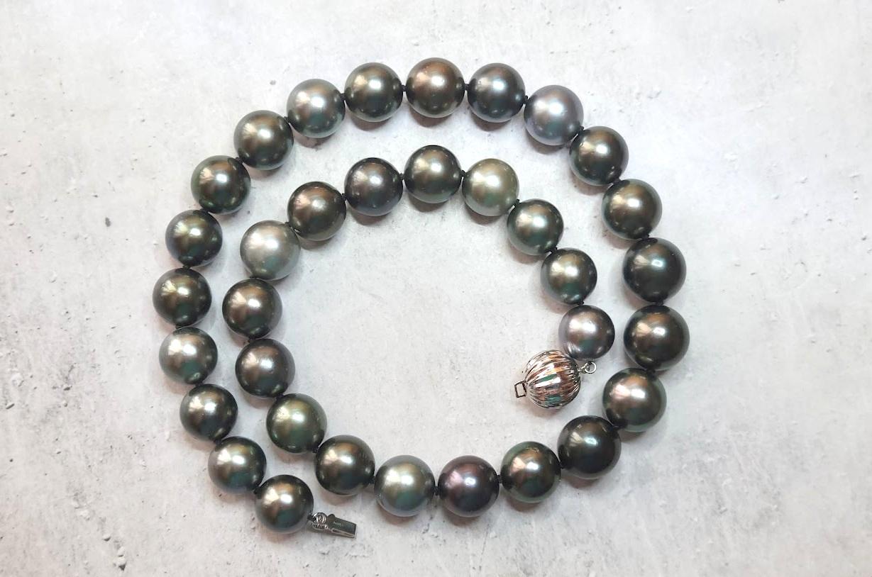 Introducing an elegant necklace crafted from natural, high-quality black Tahitian pearls length 17.5