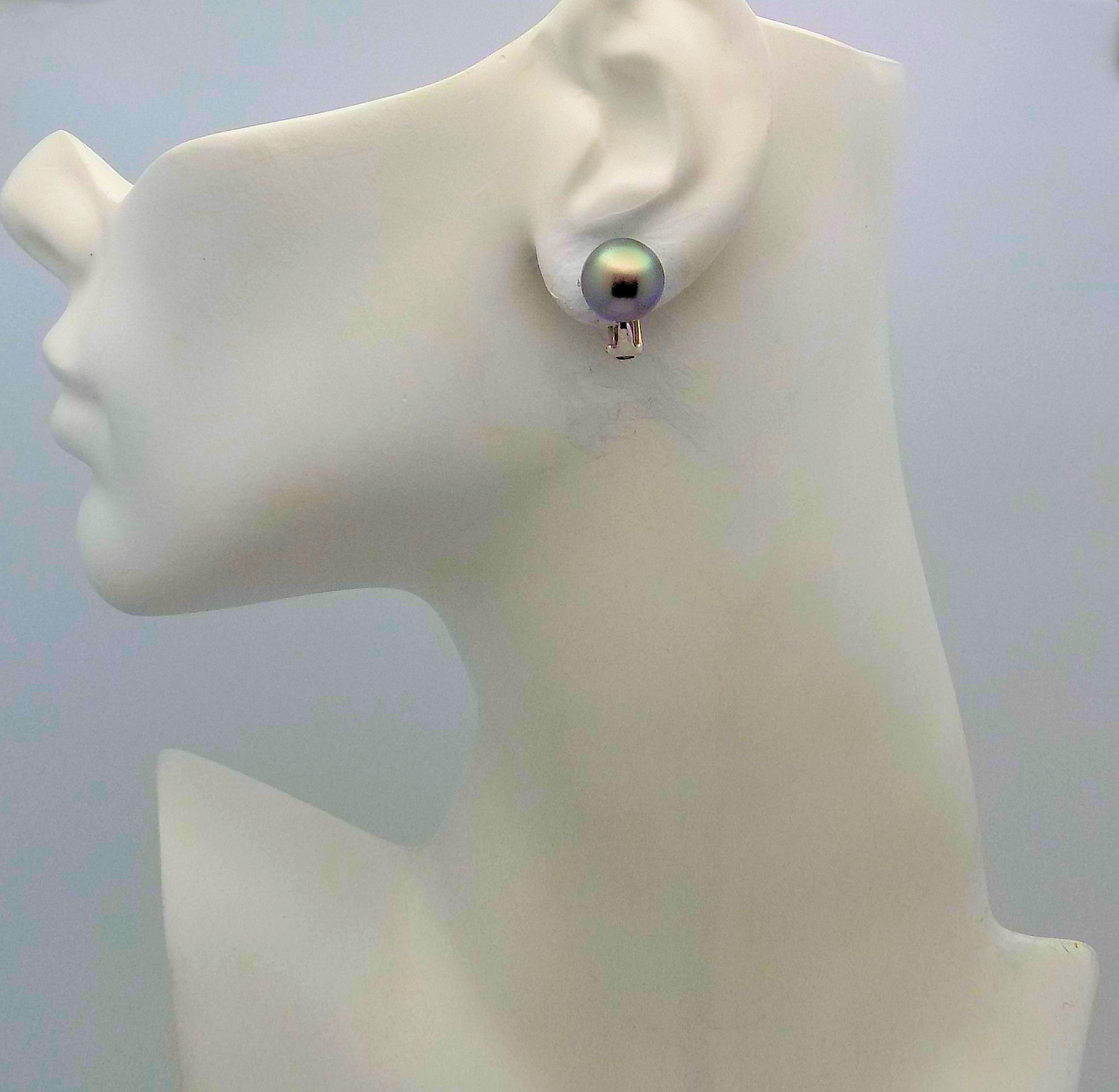 Classic Pair of Platinum & 18 karat White Gold Clip Earrings Featuring 2 Tahitian South Sea Cultured Pearls 11.7 X 12.0 MM with Medium Light Peacock Overtones 5.6 DWT or 8.71 Grams.