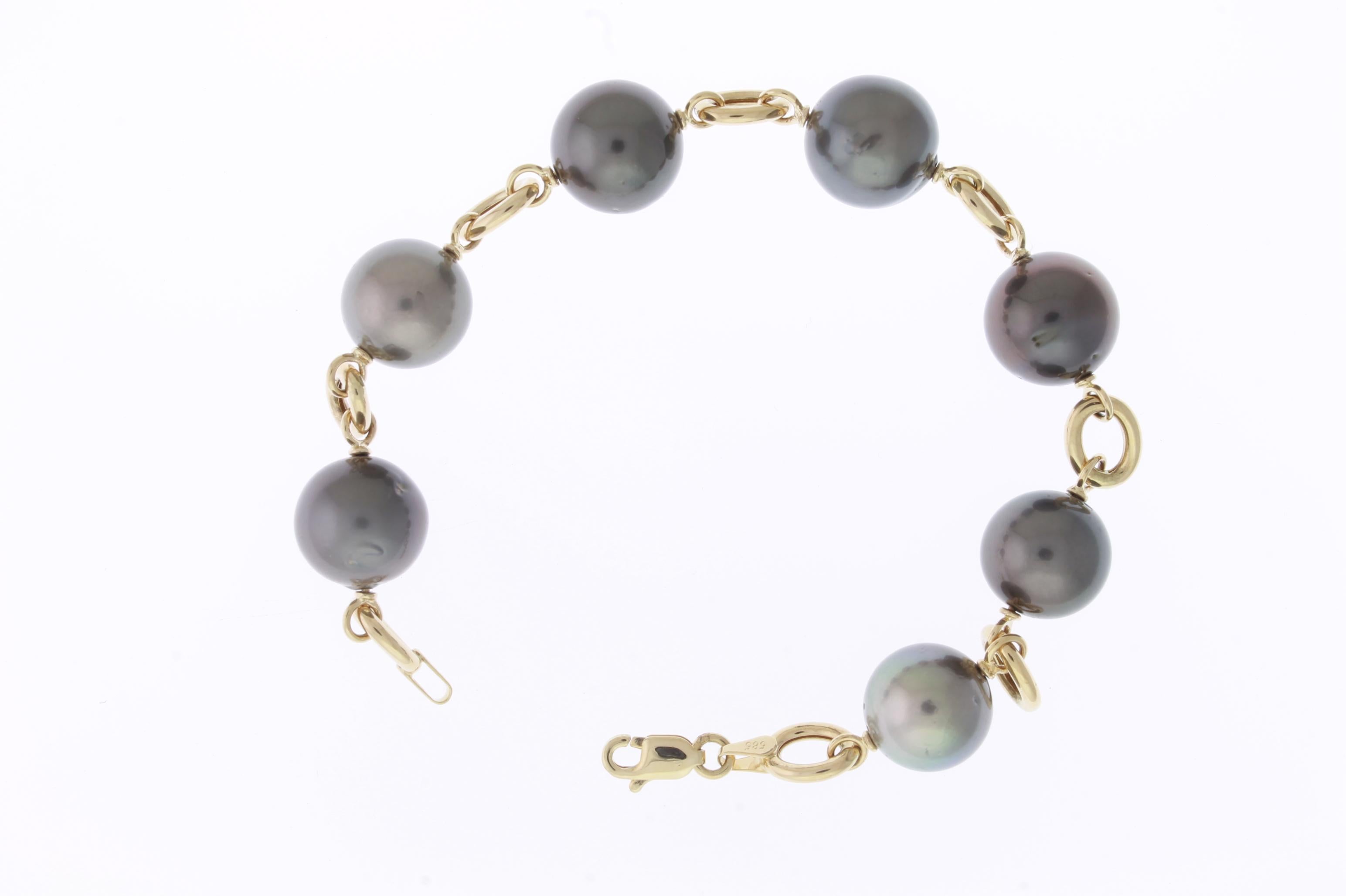 Material: 14K Yellow Gold 
Stone Details: 7 Tahitian South Sea Pearls - 12mm Each

Fine one-of-a-kind craftsmanship meets incredible quality in this breathtaking piece of jewelry.

All Alberto pieces are made in the U.S.A and include a lifetime