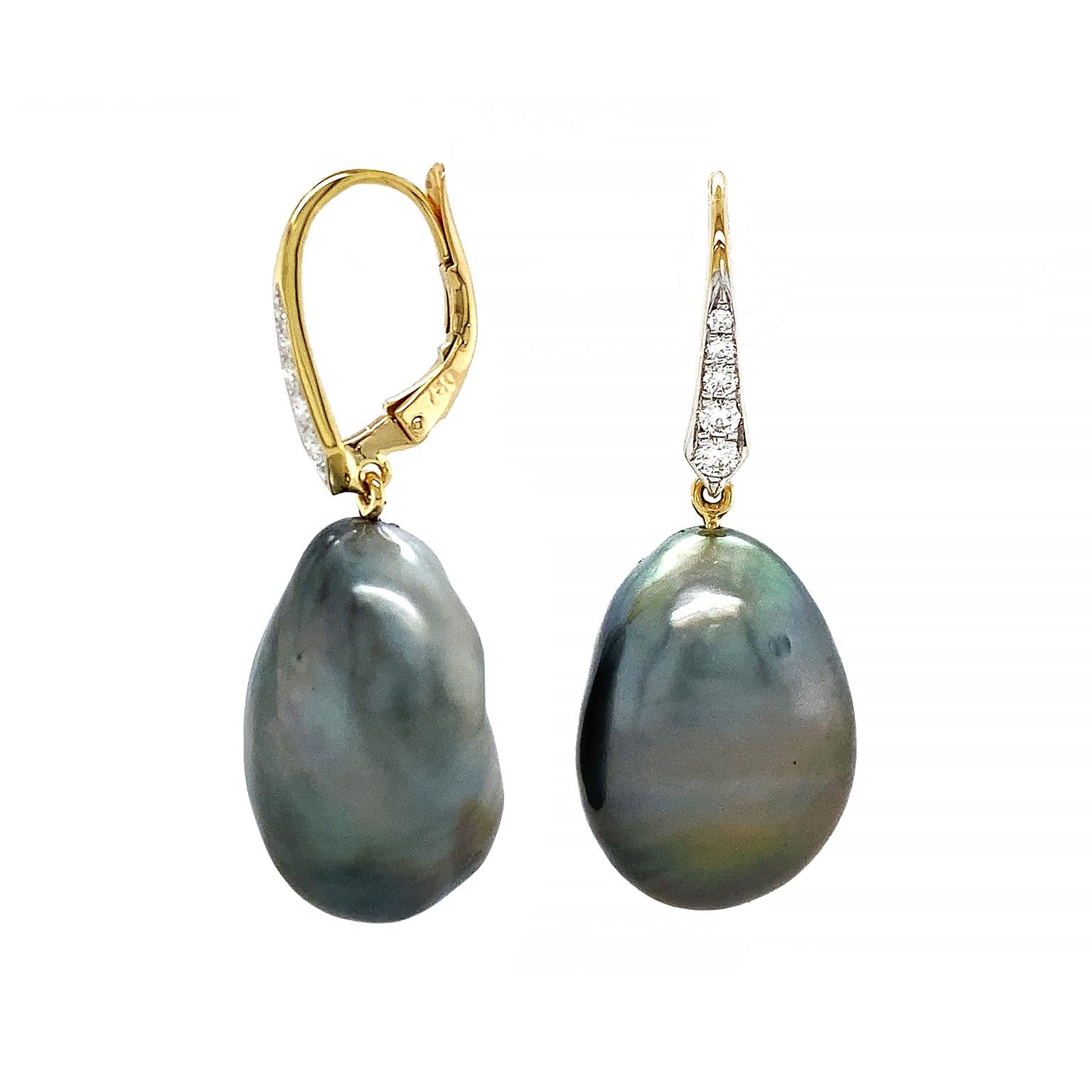 A prismatic sheen of blue, green and purple is created when the light falls upon these dark gray Tahitian pearl earrings. The baroque pearls are in a teardrop outline, while their irregular shapes form a unique pairing. 18k yellow gold lever backs